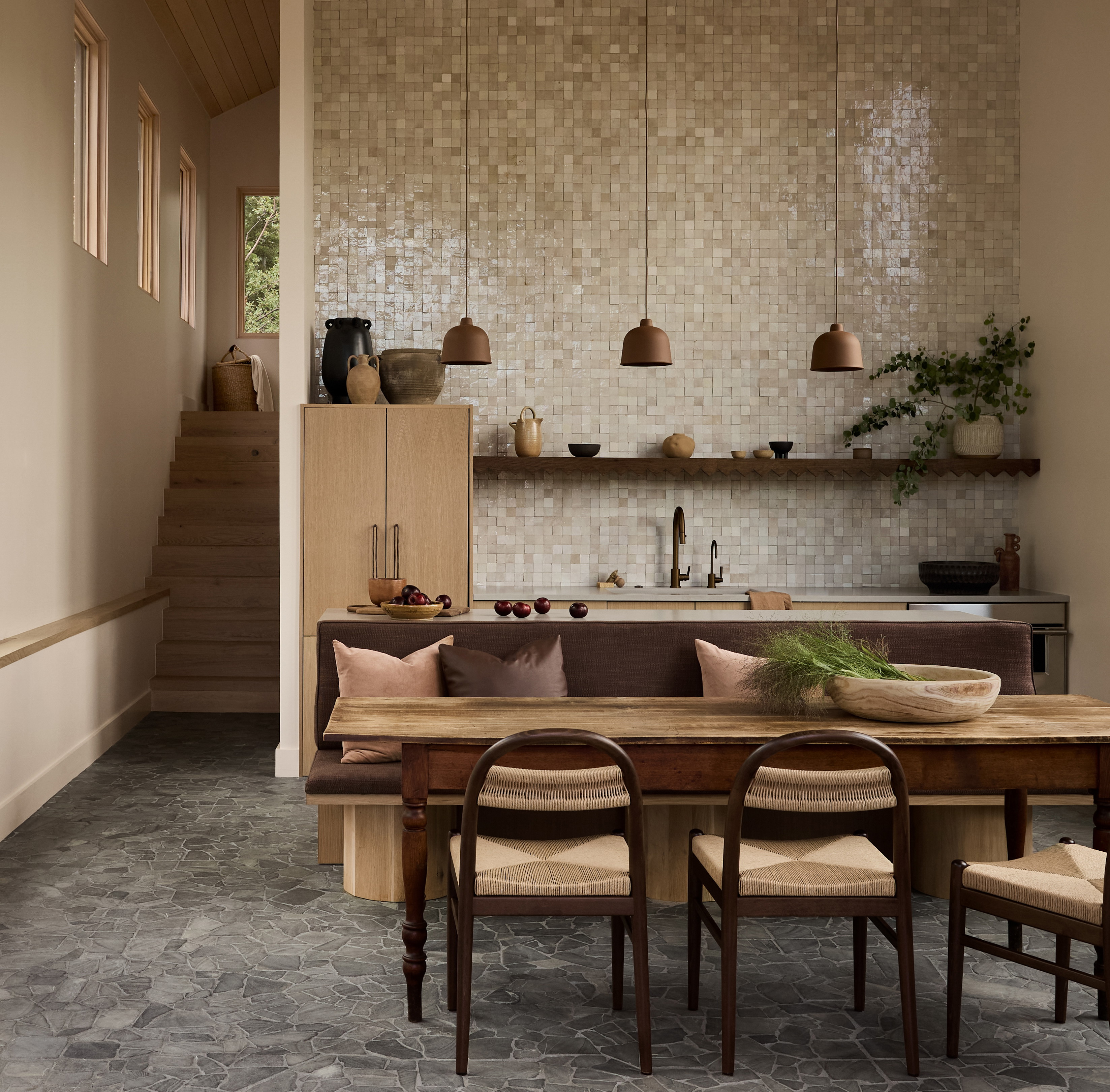 a dining room with a table and chairs