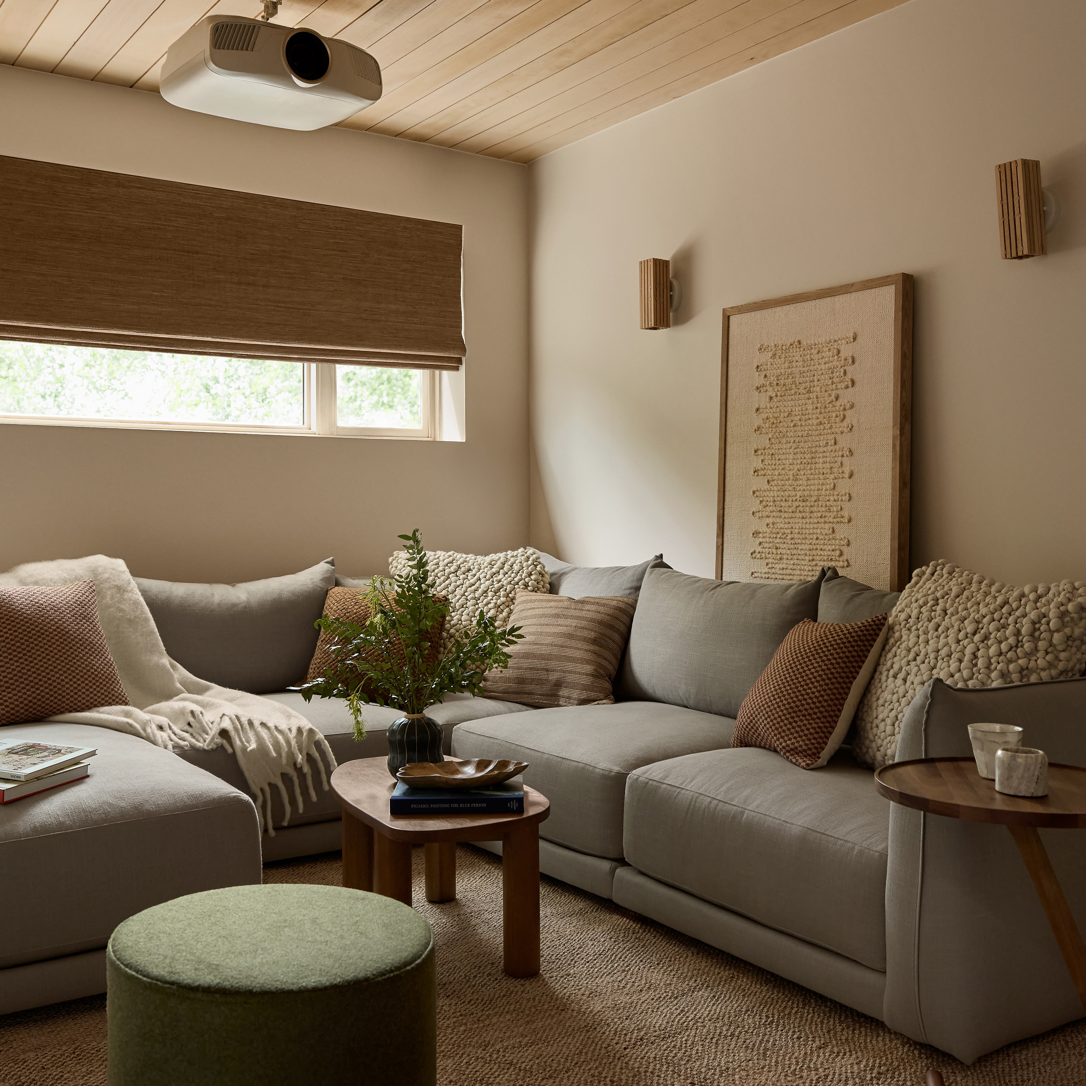 a living room filled with furniture and a window