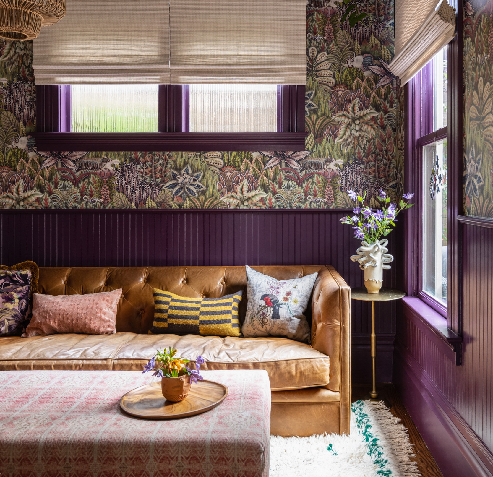 a living room filled with furniture and a window