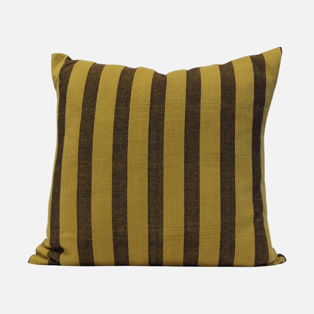 a brown and black striped pillow on a white background