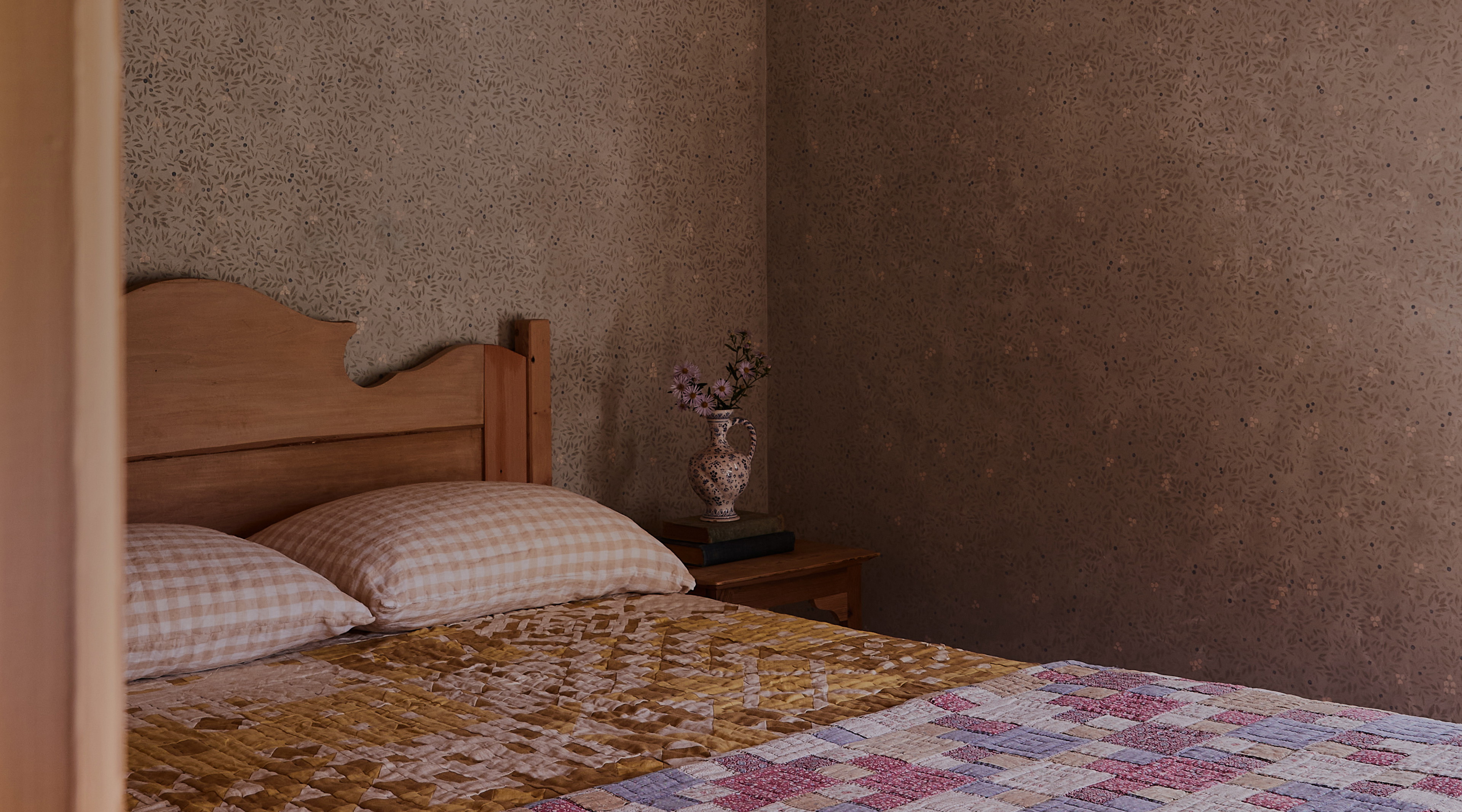 a bed with a checkered bedspread in a bedroom