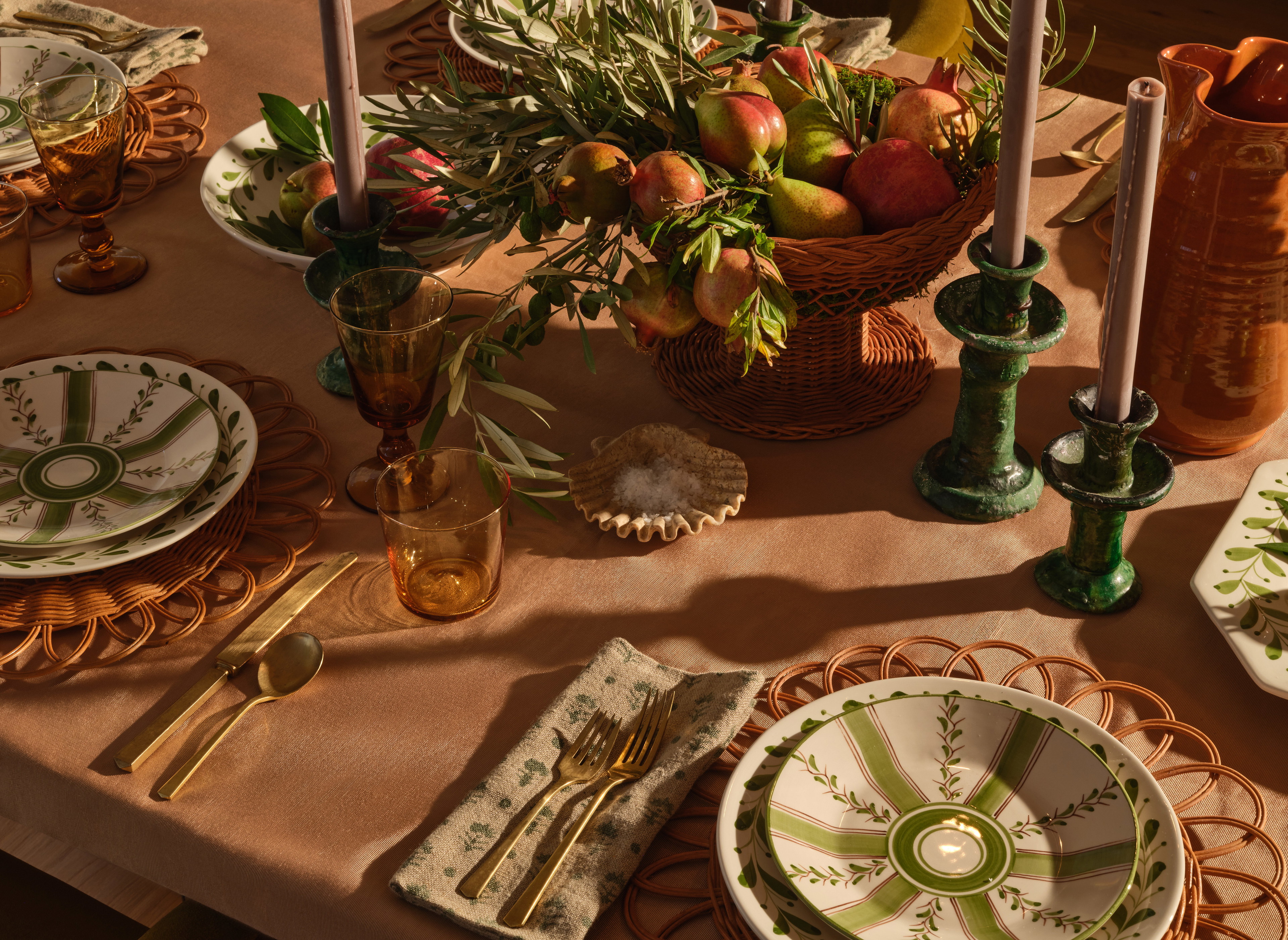 a table topped with plates and bowls of food