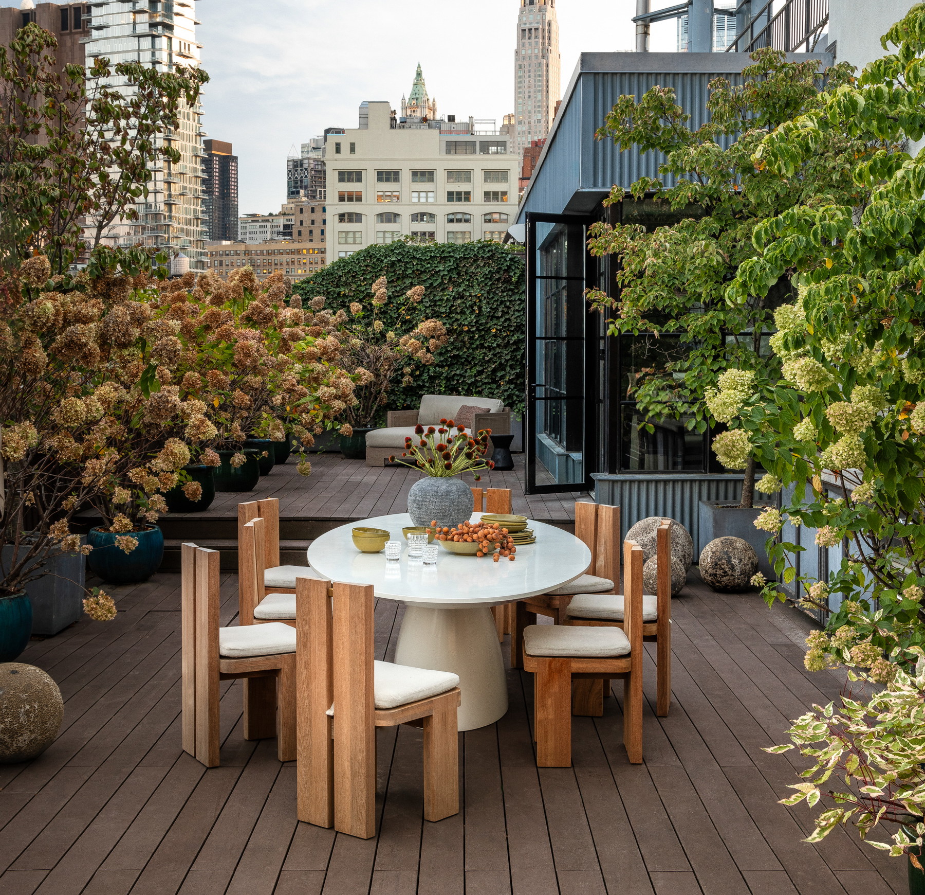 a table and chairs on a wooden deck