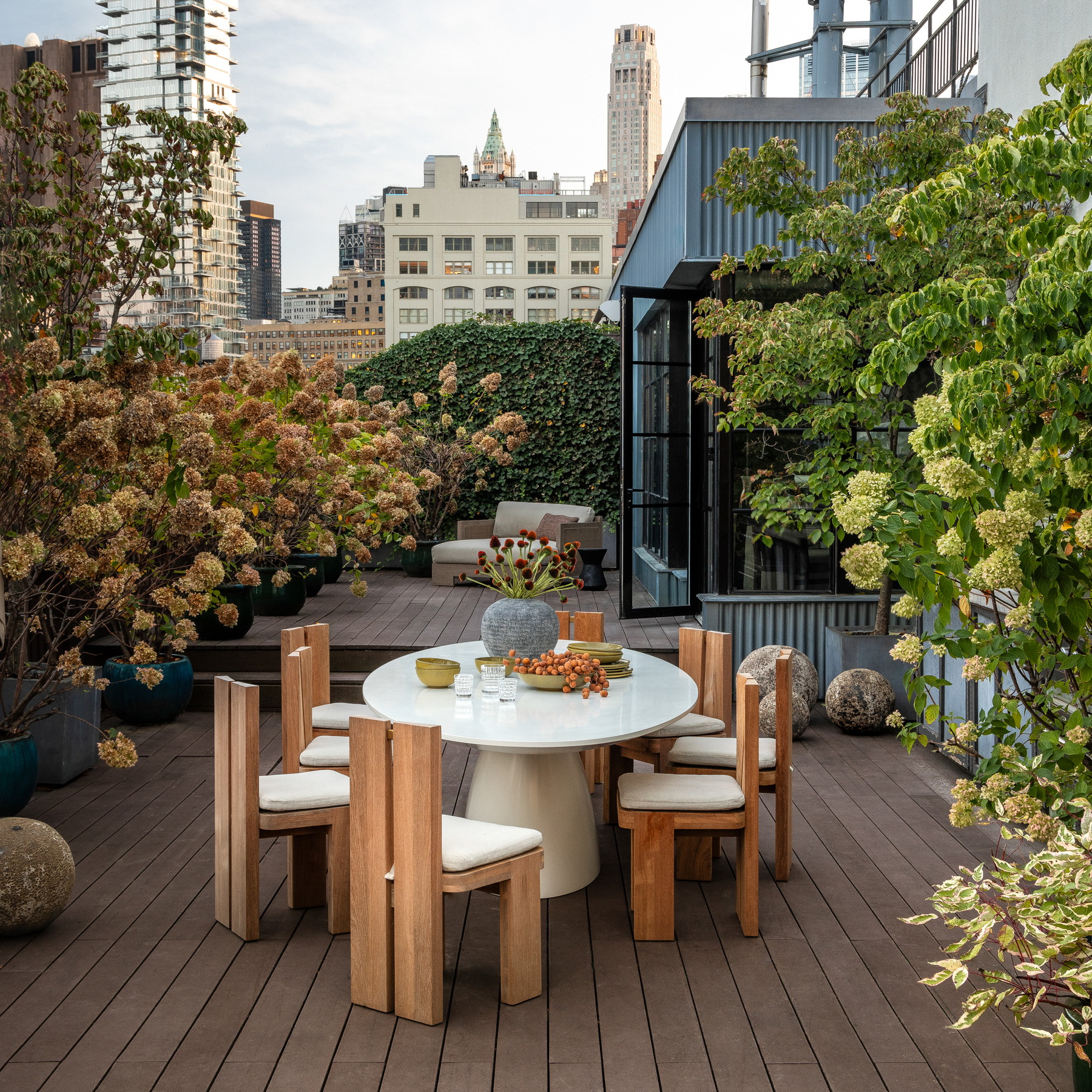 a table and chairs on a wooden deck