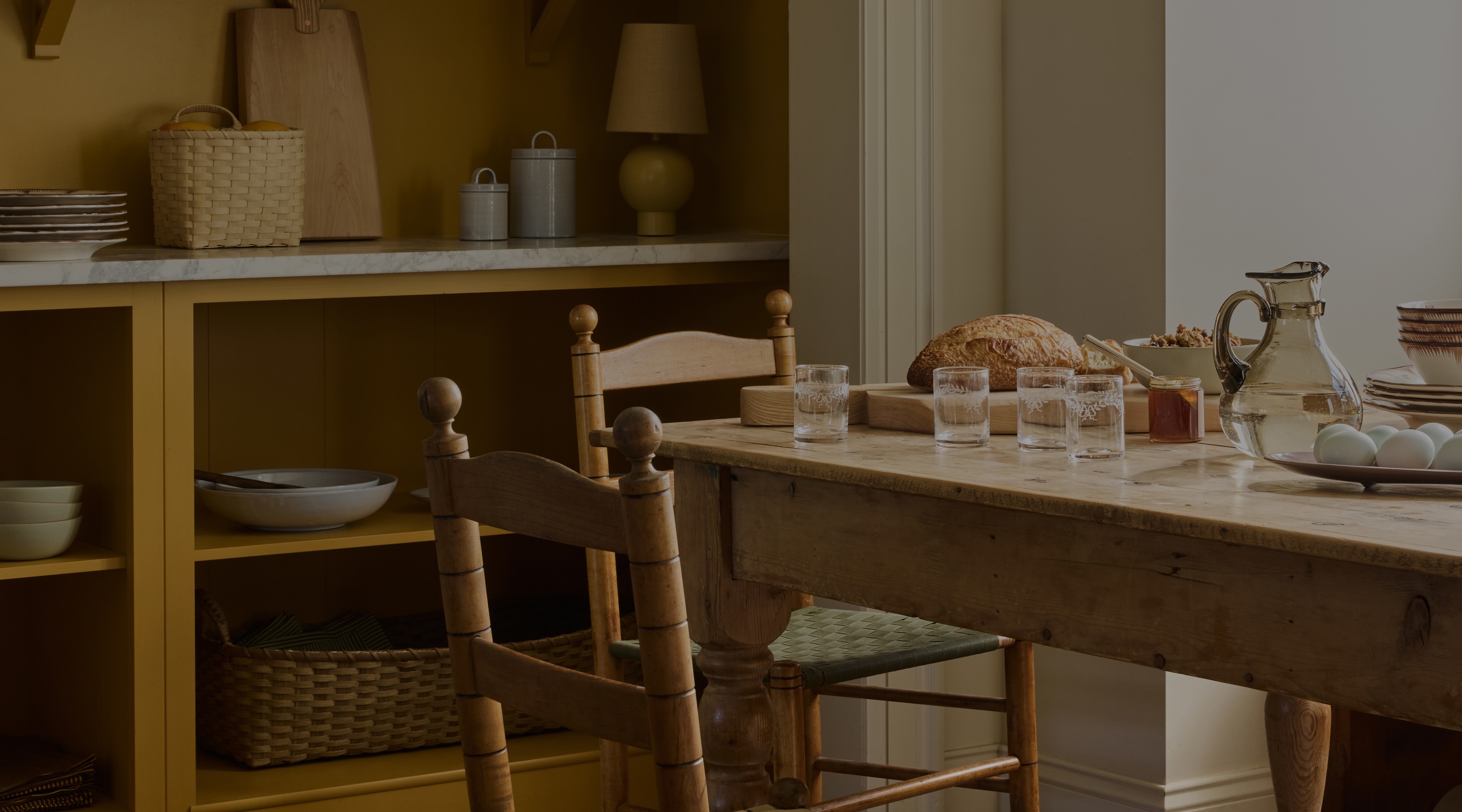 a wooden table topped with lots of dishes