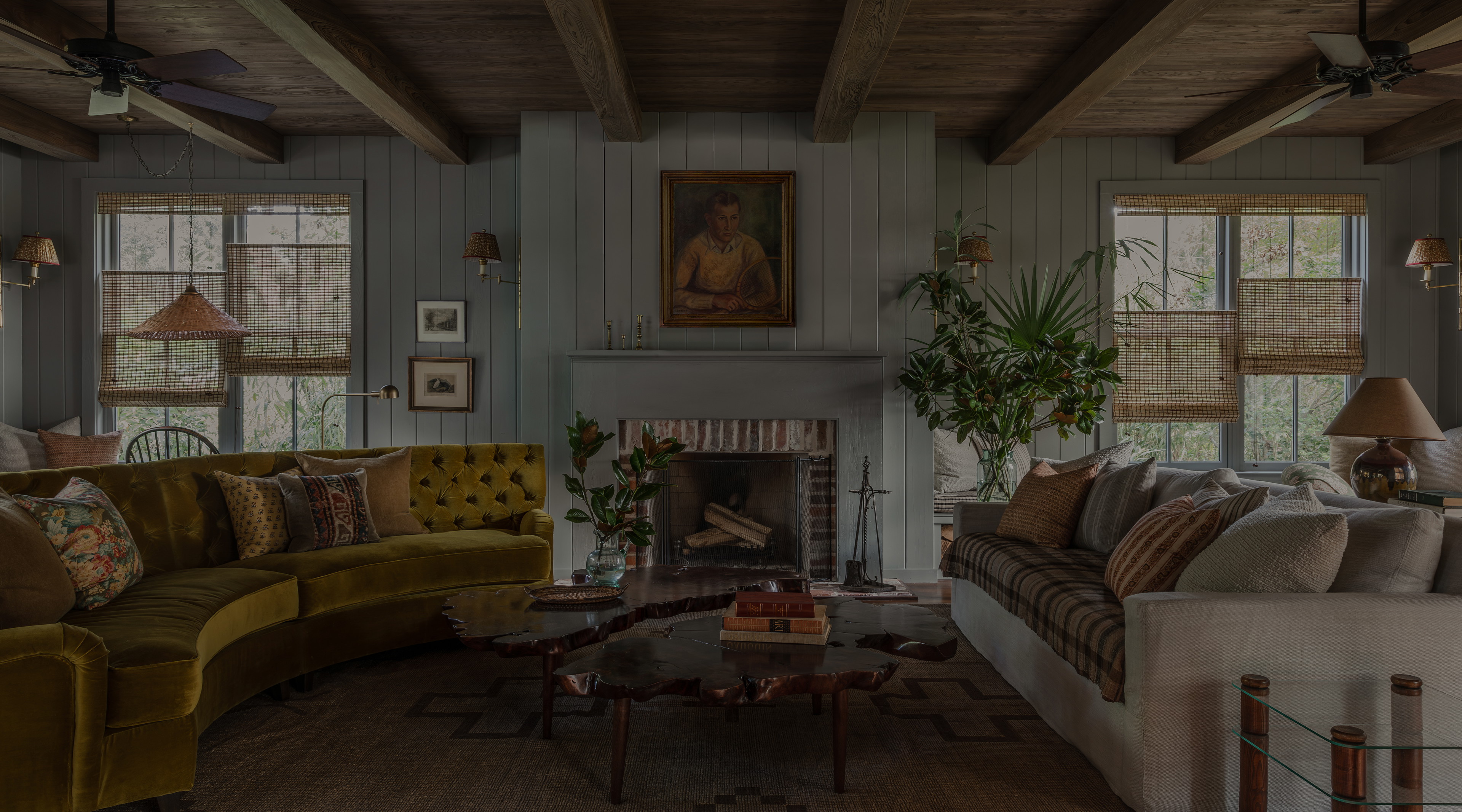 a living room filled with furniture and a fire place