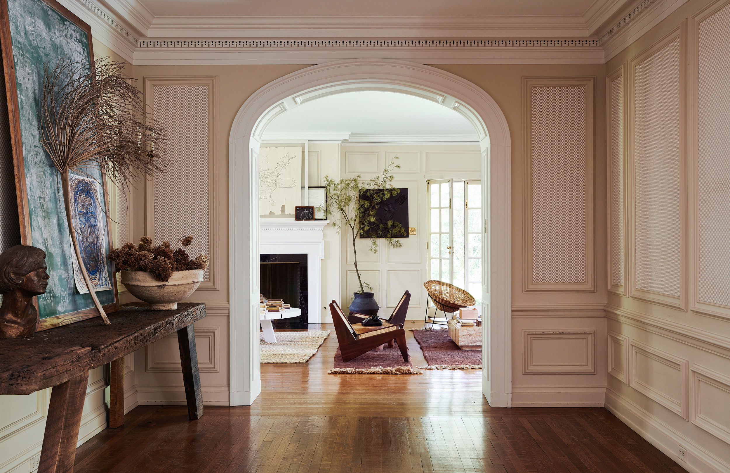 a living room with a wooden floor and a fireplace