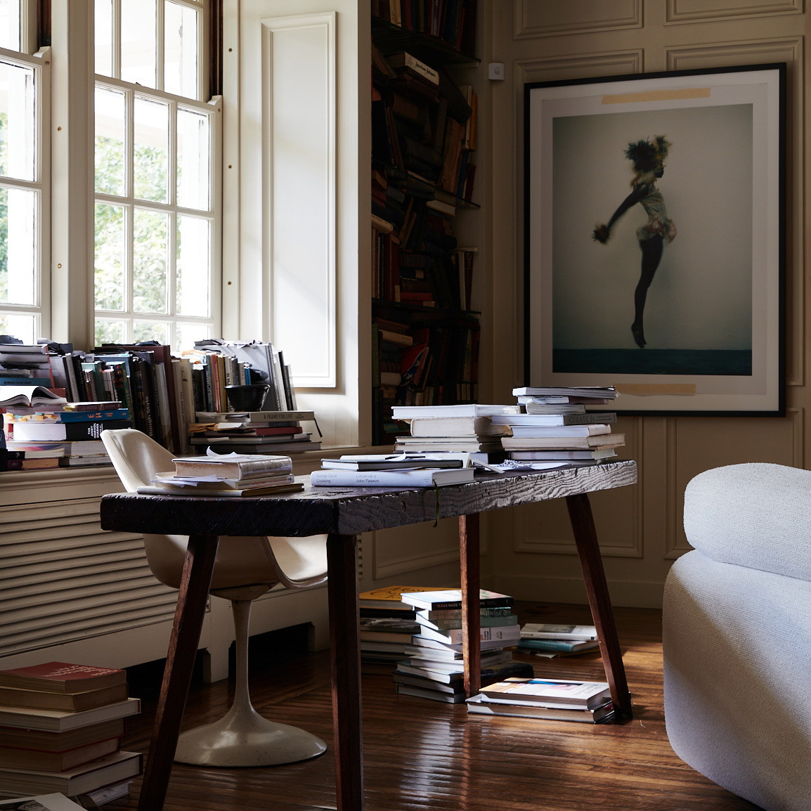 a living room filled with furniture and a book shelf