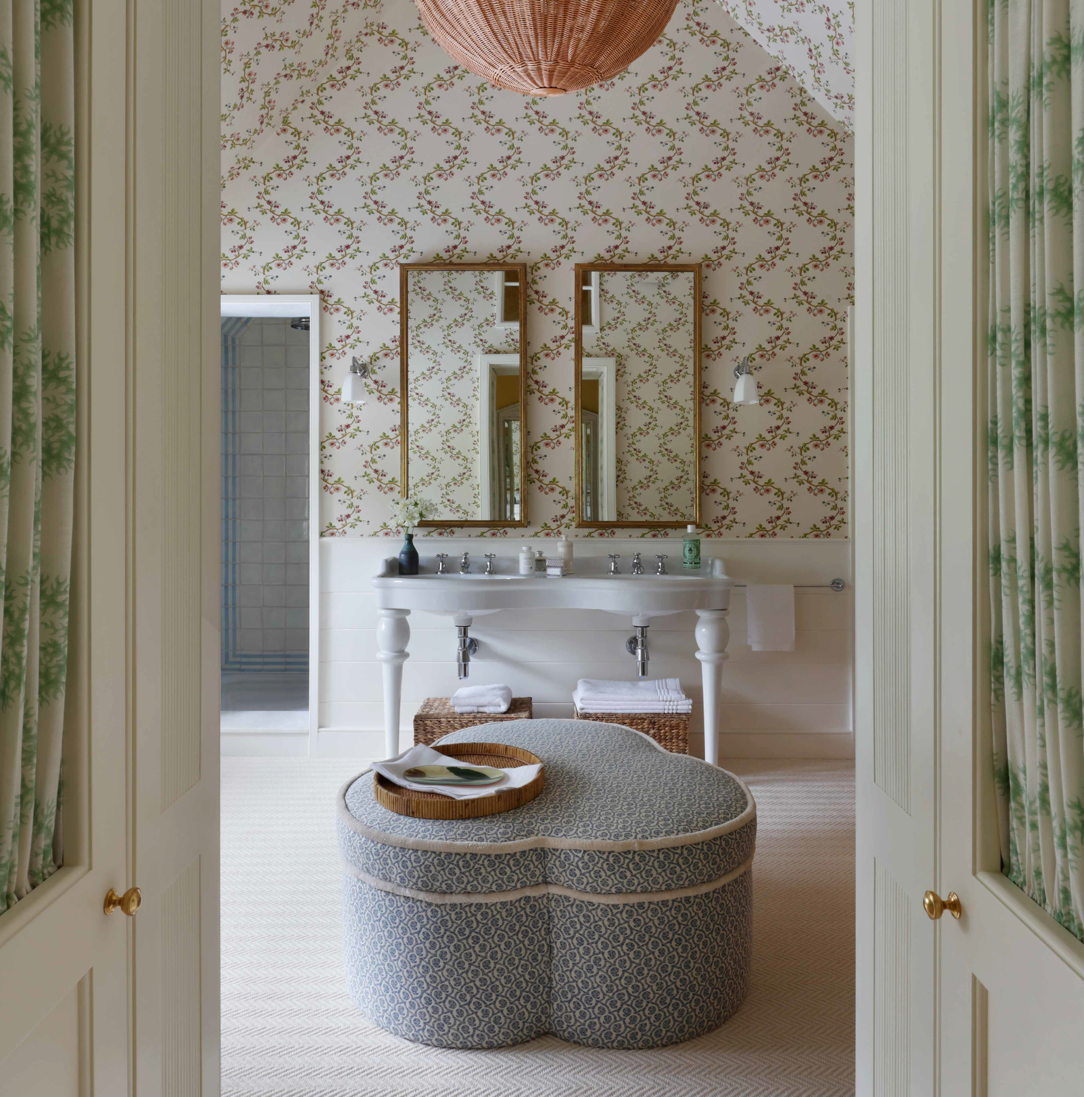 a bathroom with two sinks and a large ottoman