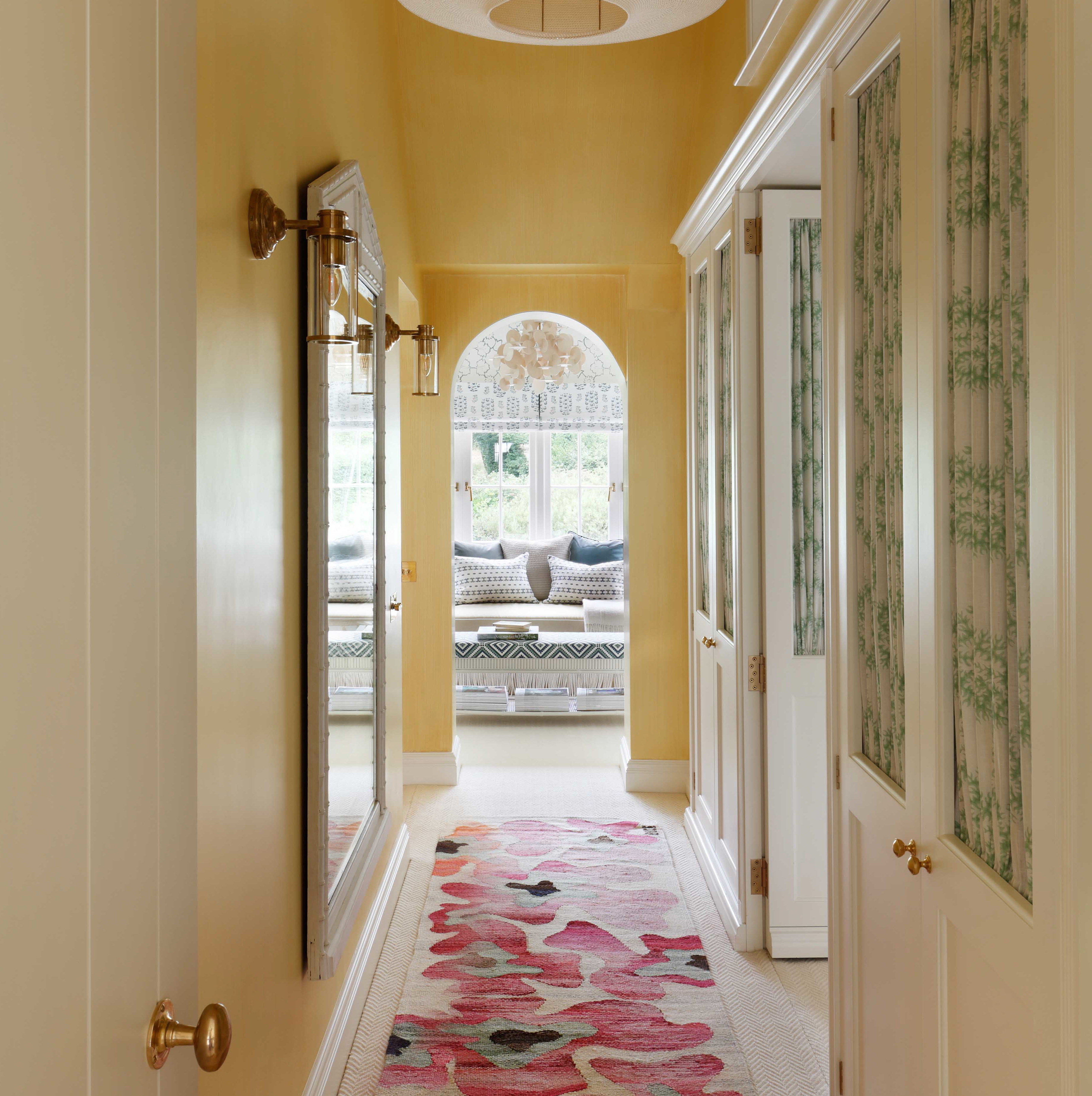 a long hallway with a rug on the floor