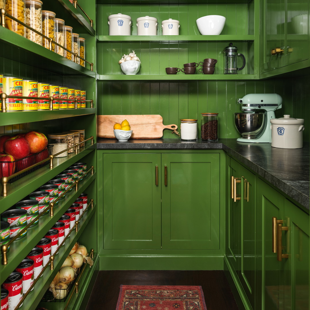 a green pantry filled with lots of food