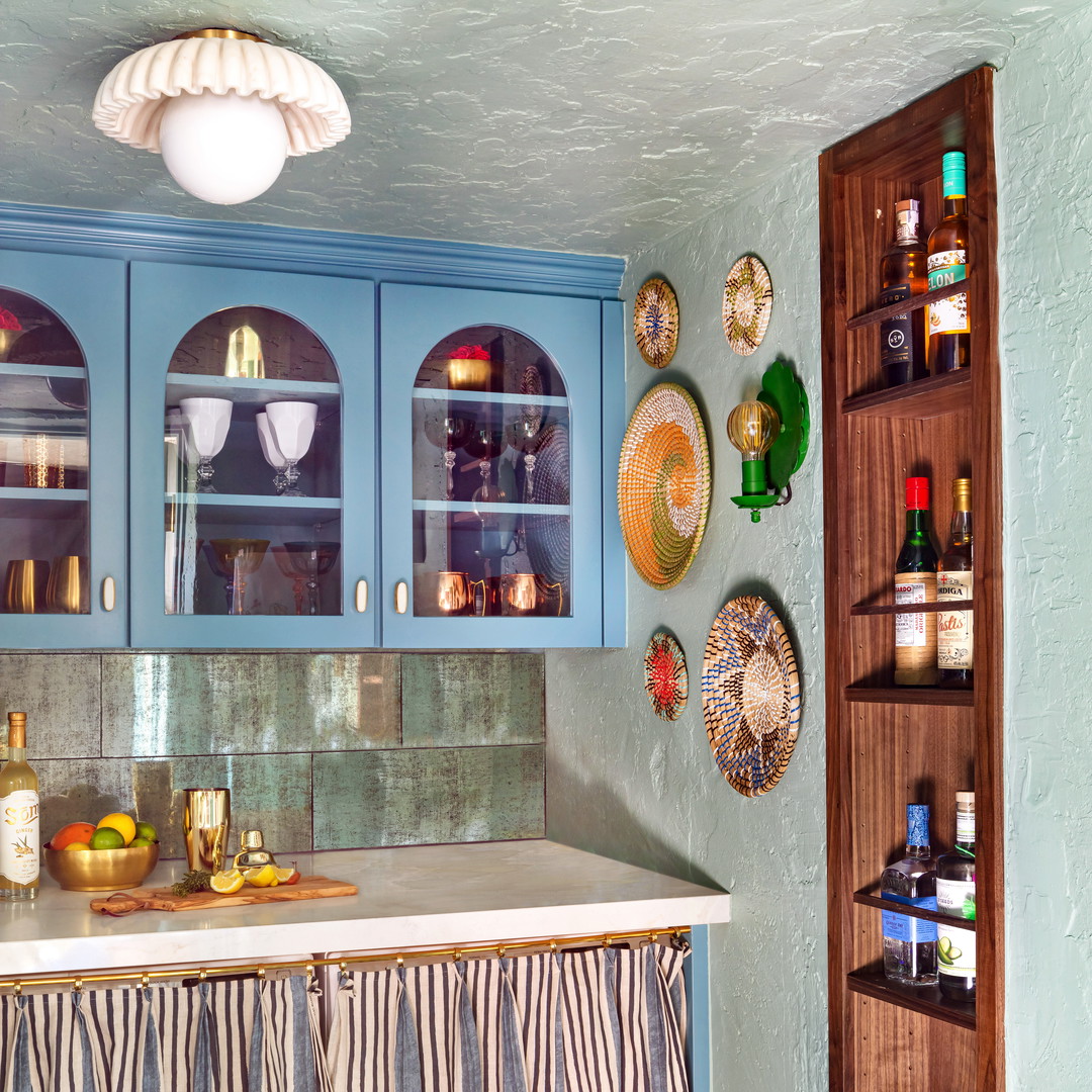 a kitchen with blue cabinets and a counter