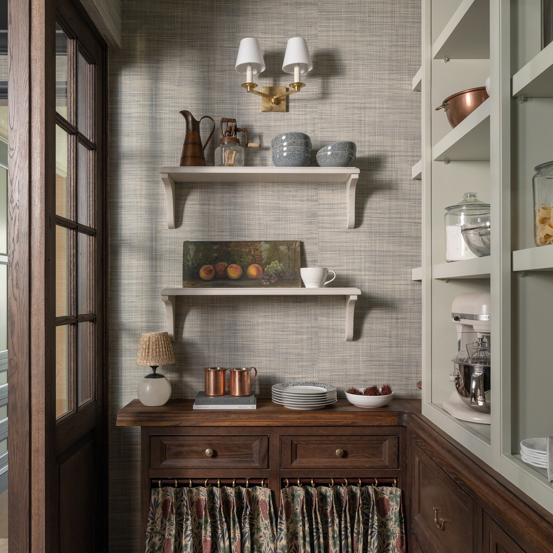 a kitchen with a wooden table and a wooden chair