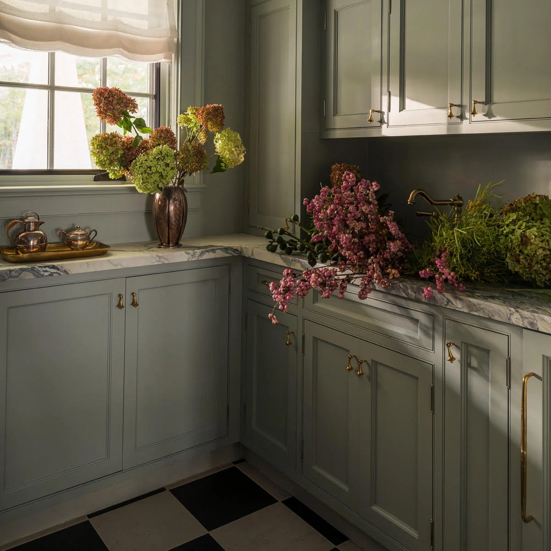 a kitchen with a checkered floor and a chandelier