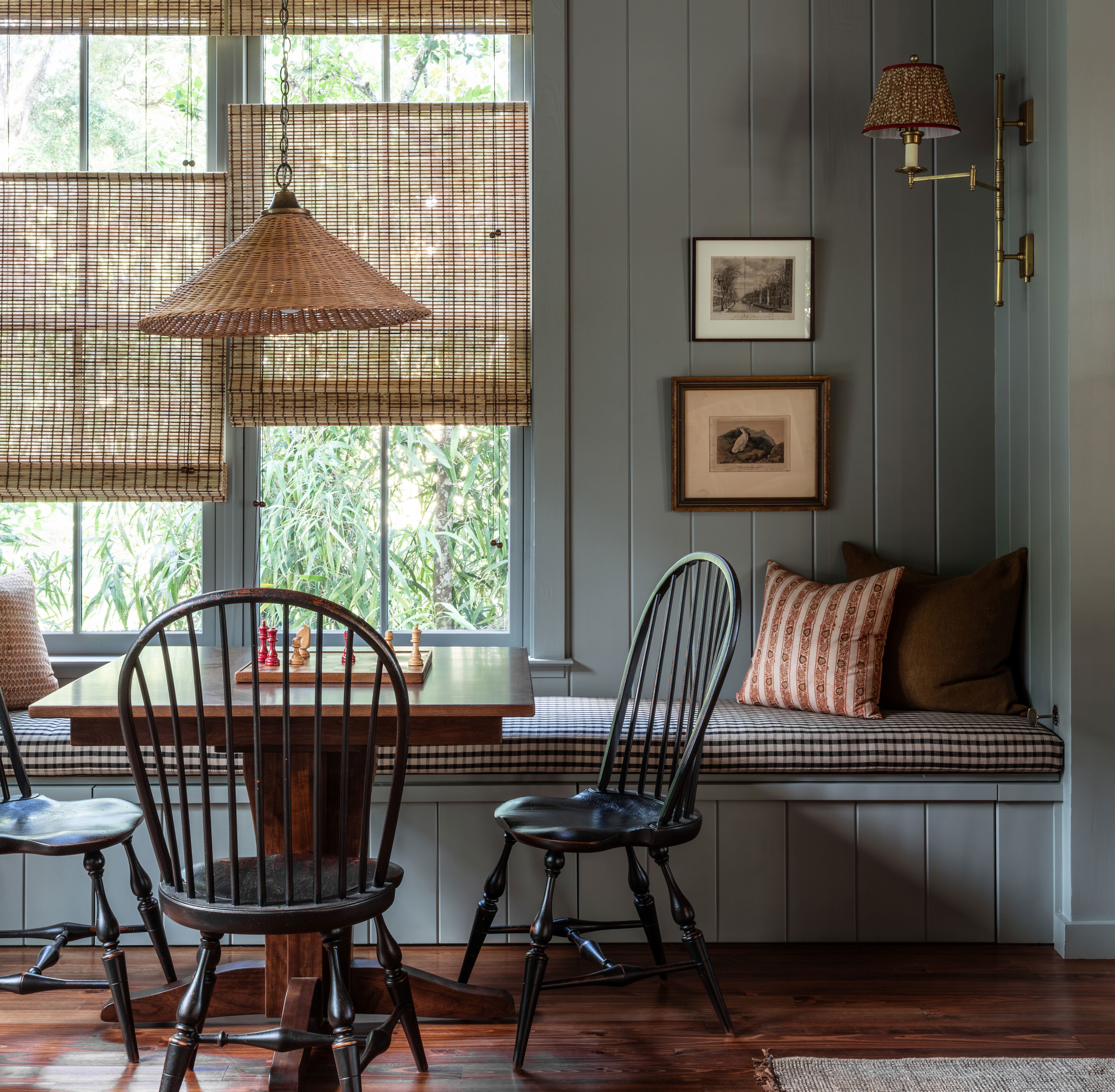 a dining room with a table and chairs