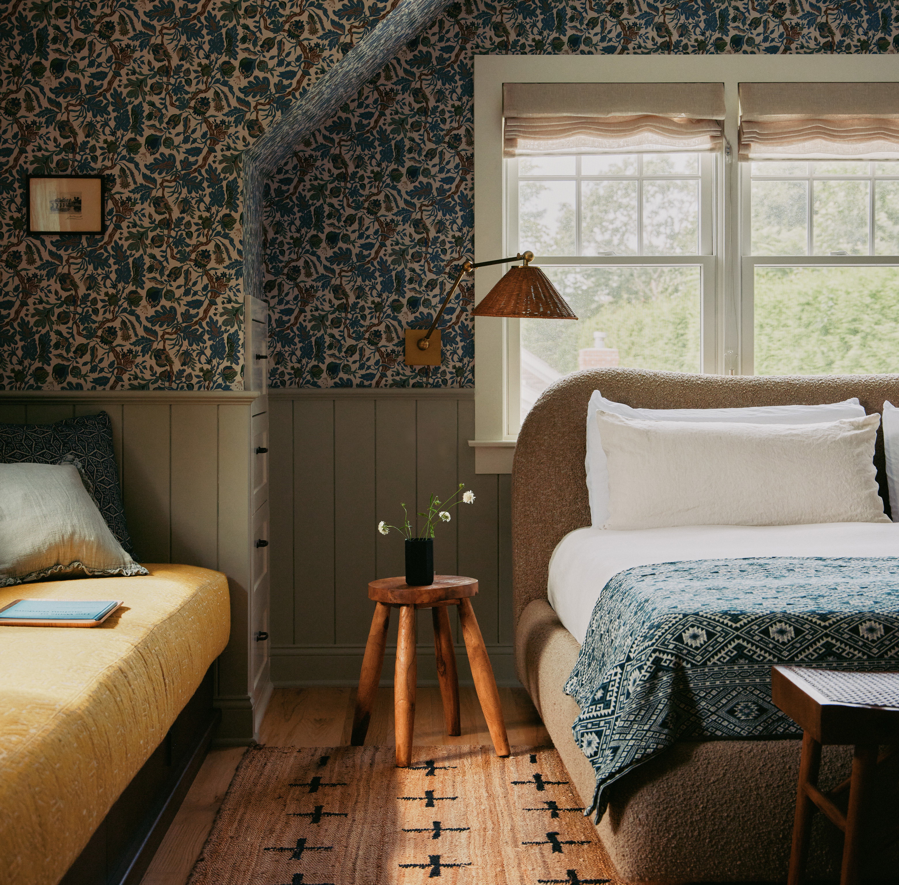 a bedroom with a bed and a night stand