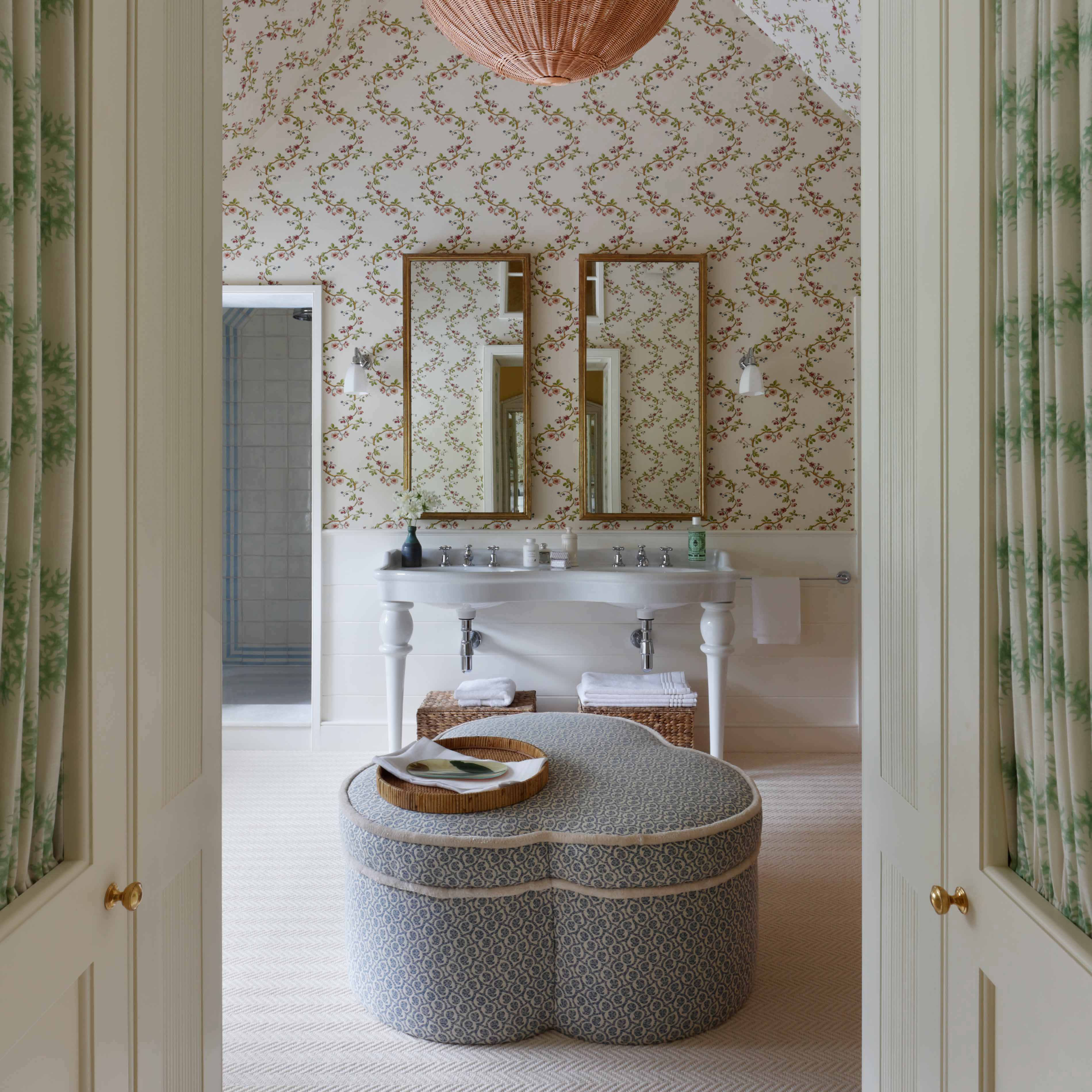 a bathroom with two sinks and a large ottoman