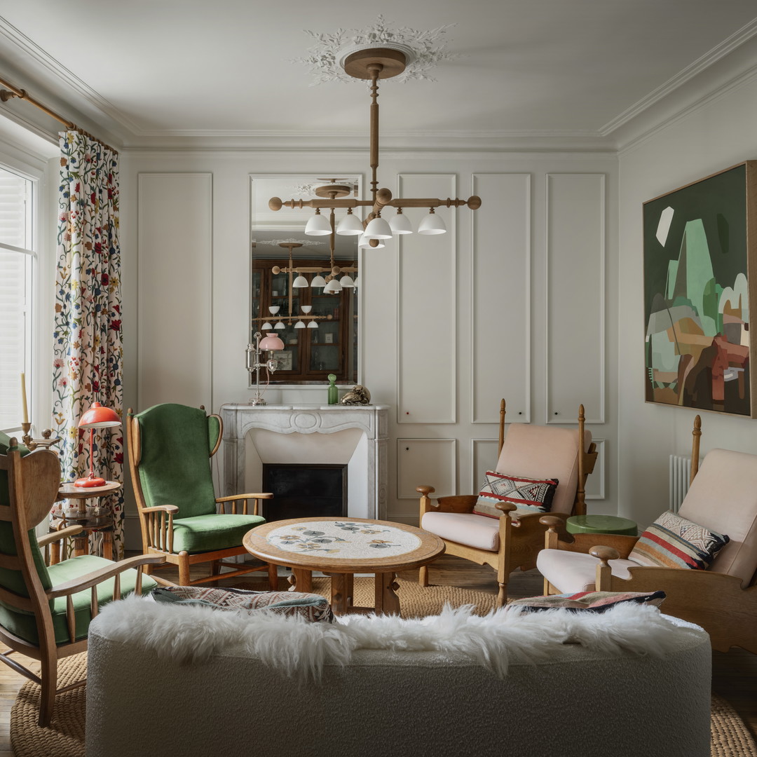 a living room filled with furniture and a fire place