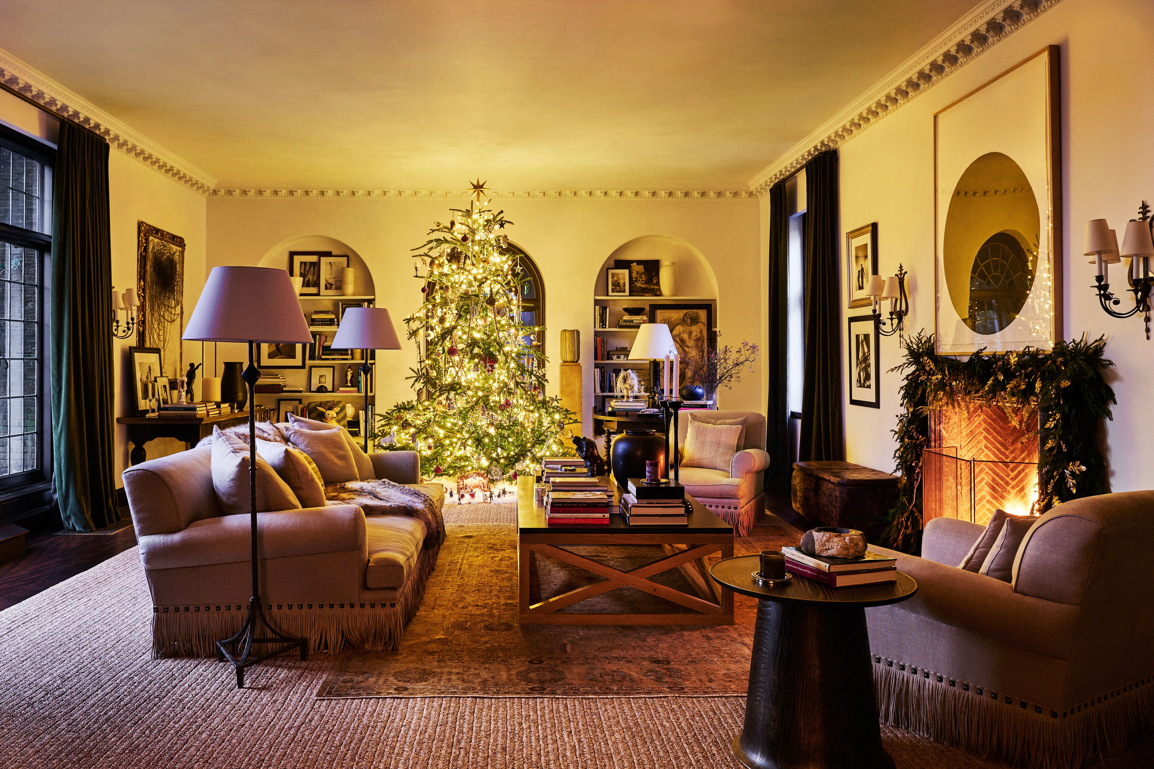 a living room filled with furniture and a christmas tree