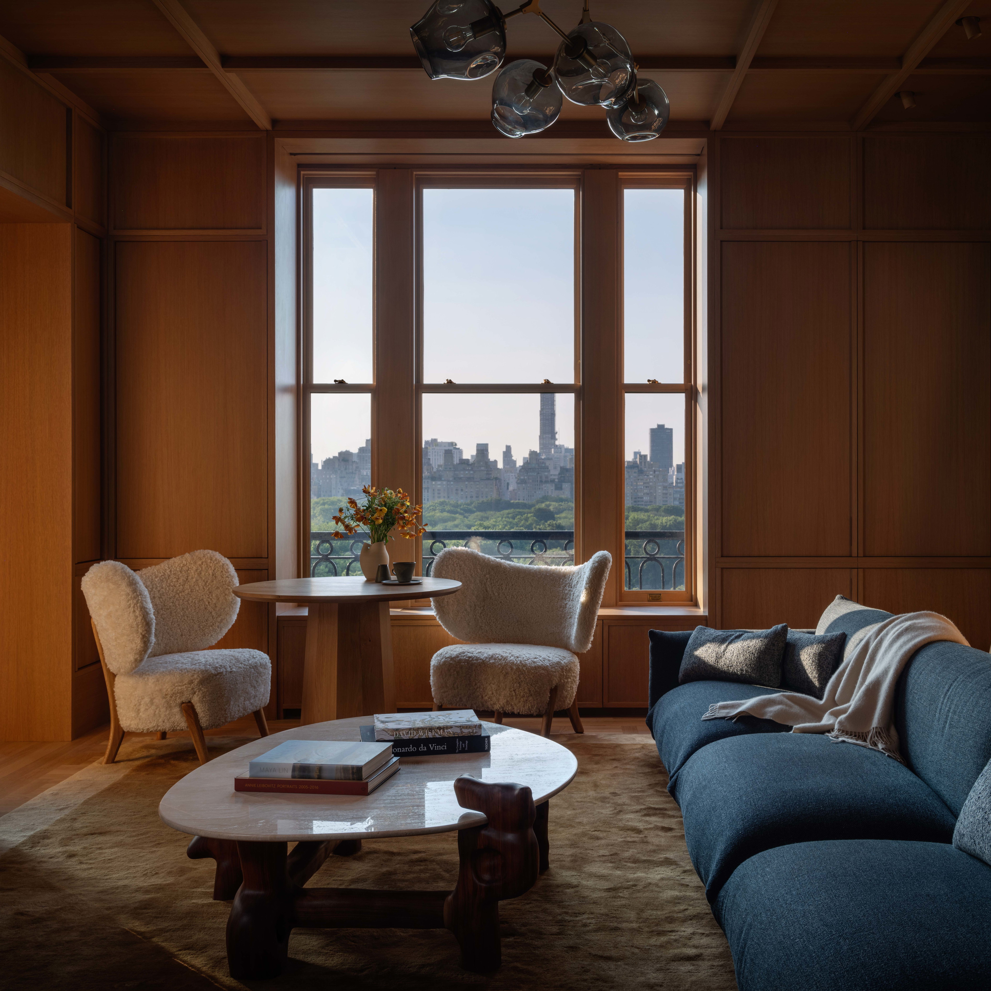 a living room filled with furniture and a large window