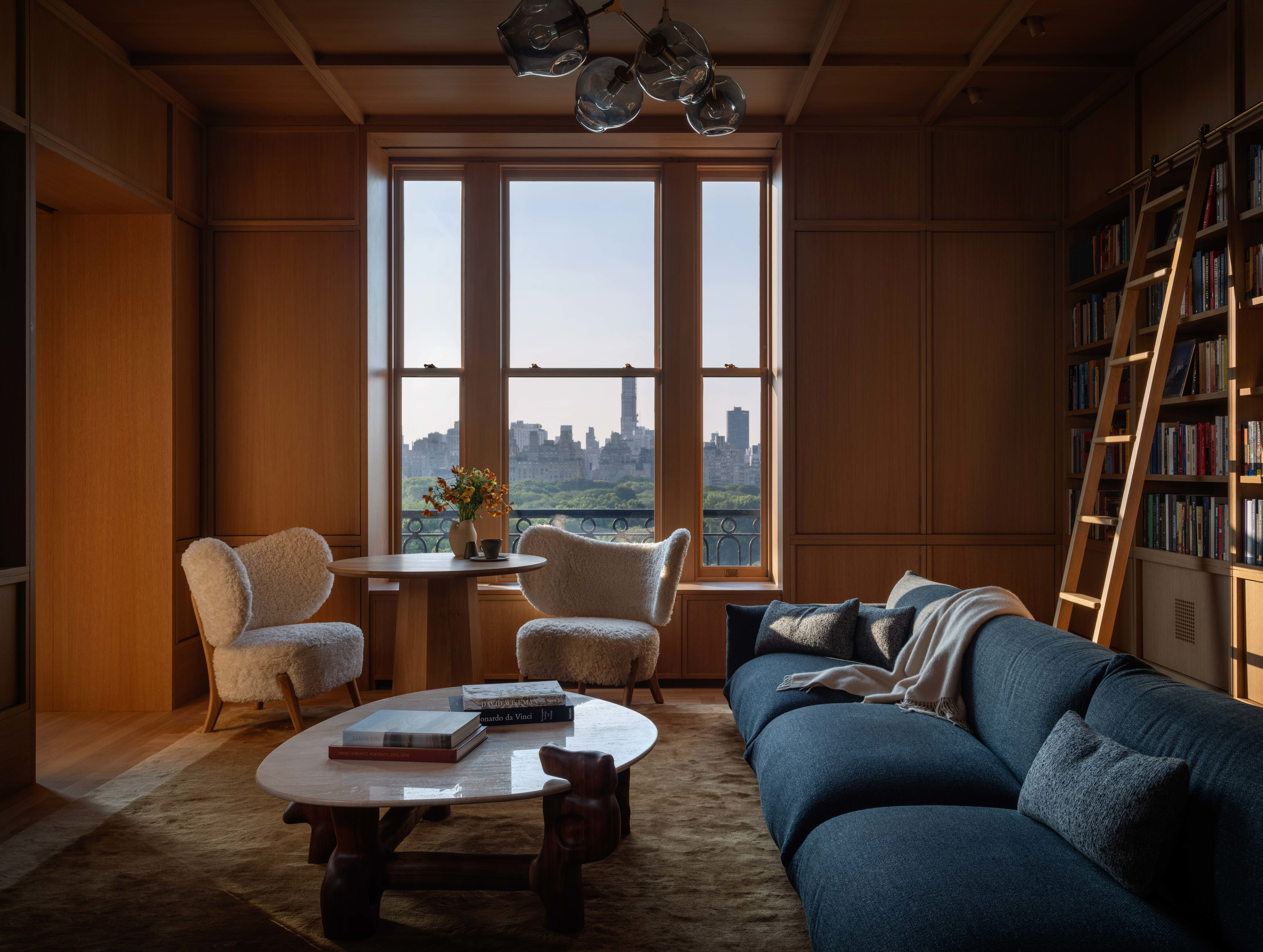 a living room filled with furniture and a large window