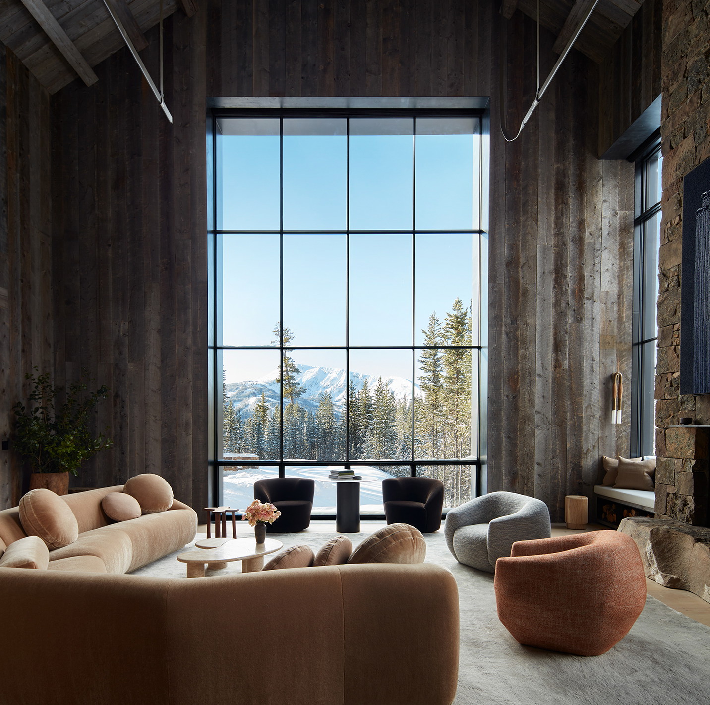 a living room filled with furniture and a large window