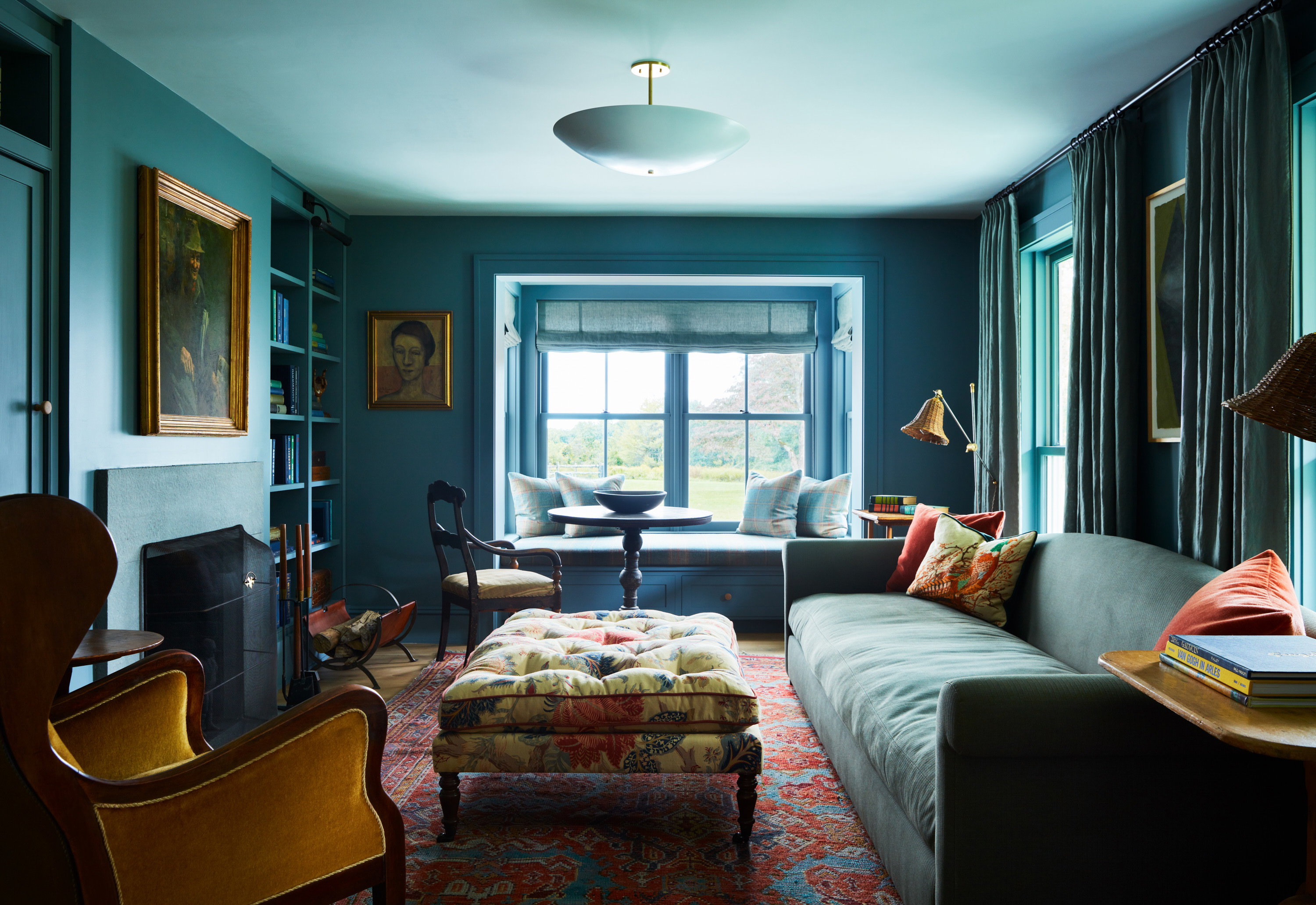 a living room filled with furniture and a fire place