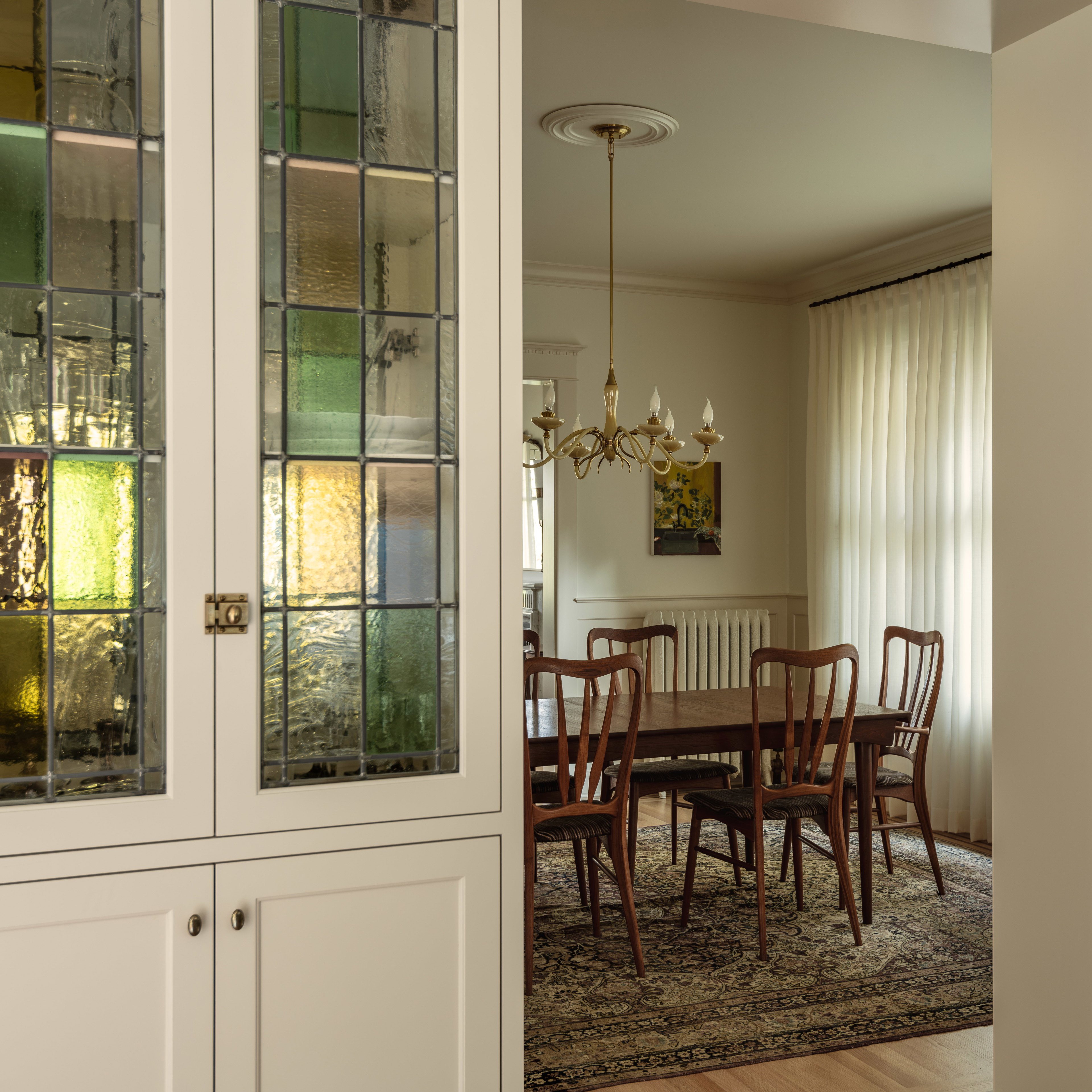 a dining room with a table and chairs in it