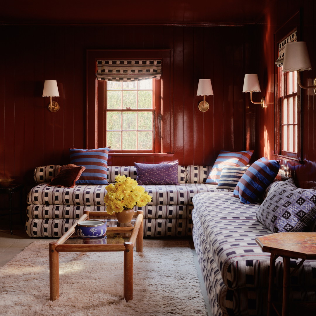 a living room filled with furniture and a window