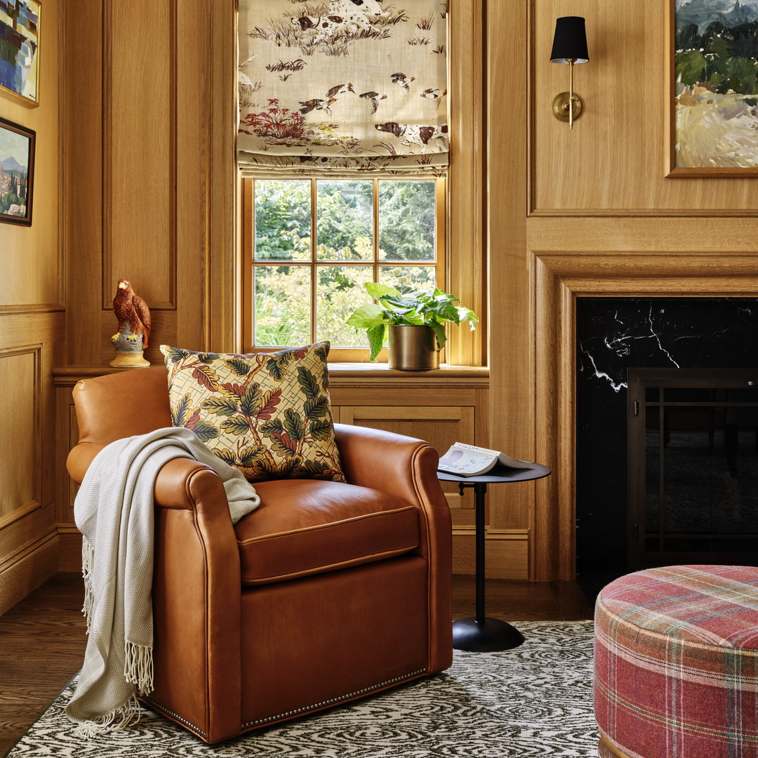 a living room filled with furniture and a fire place