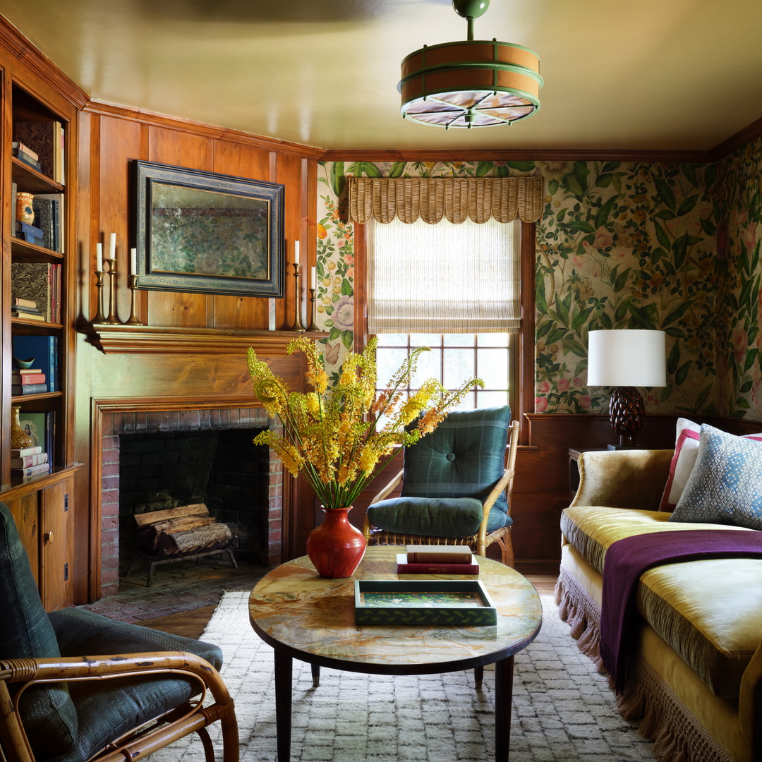 a living room filled with furniture and a fire place