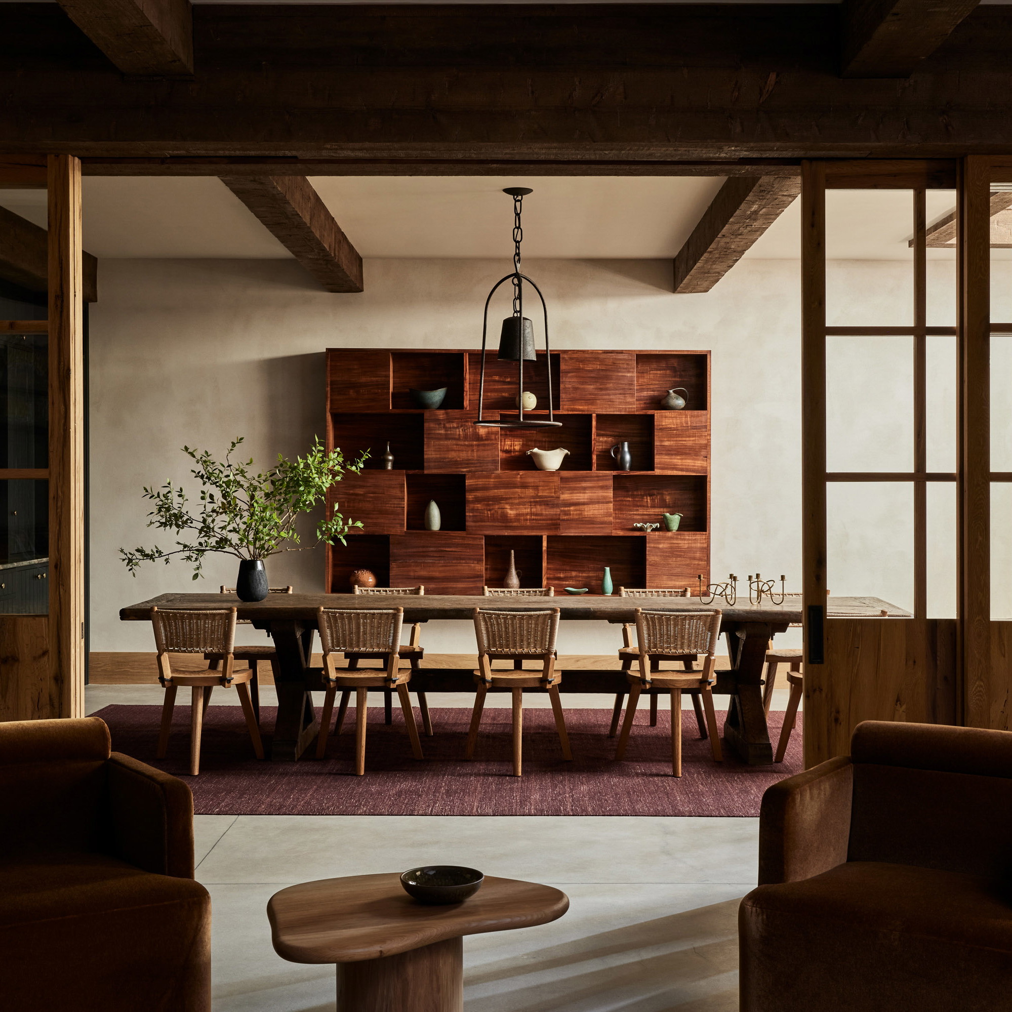 a dining room with a table and chairs