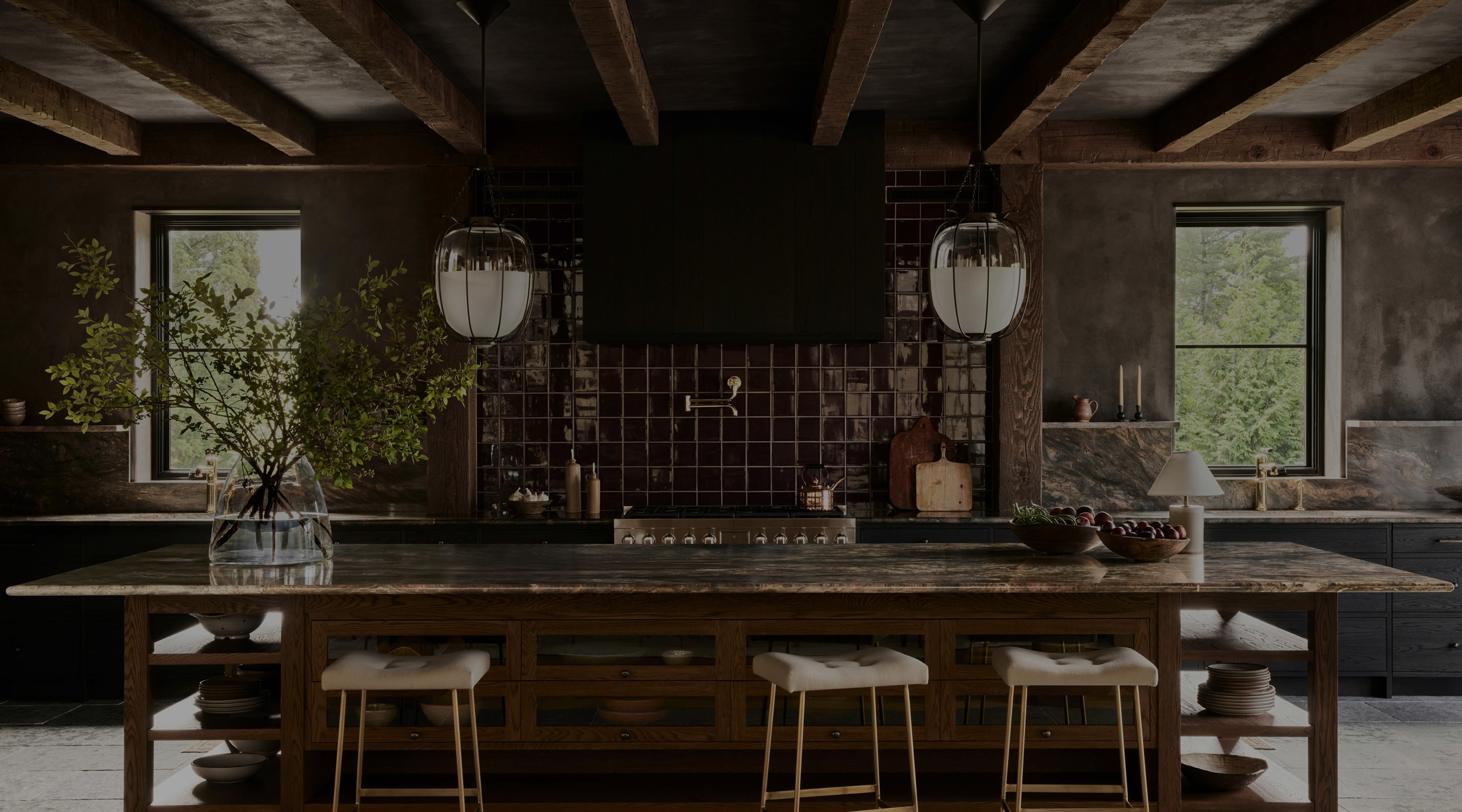 a kitchen with a table and stools in it