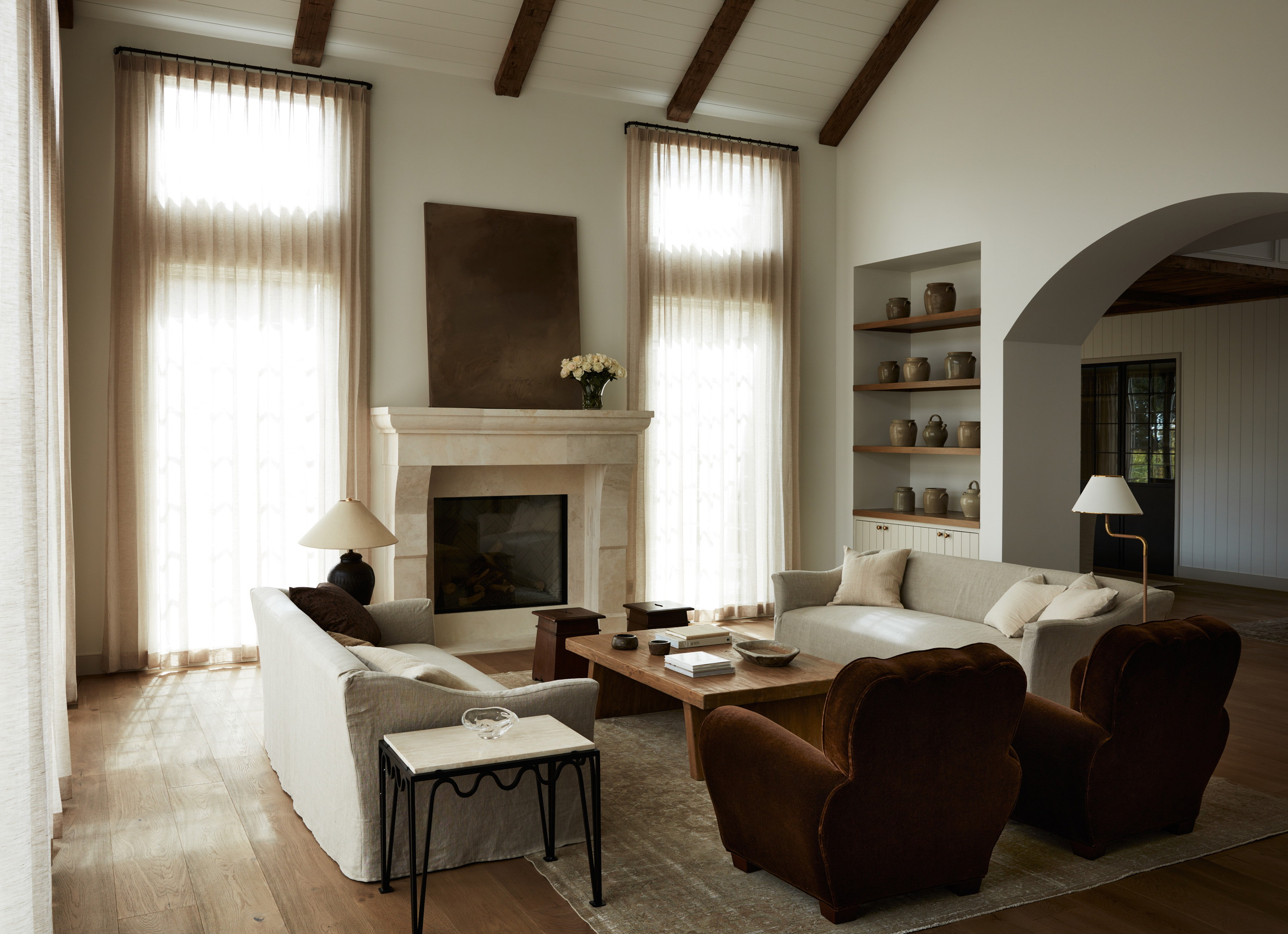 a living room filled with furniture and a fire place