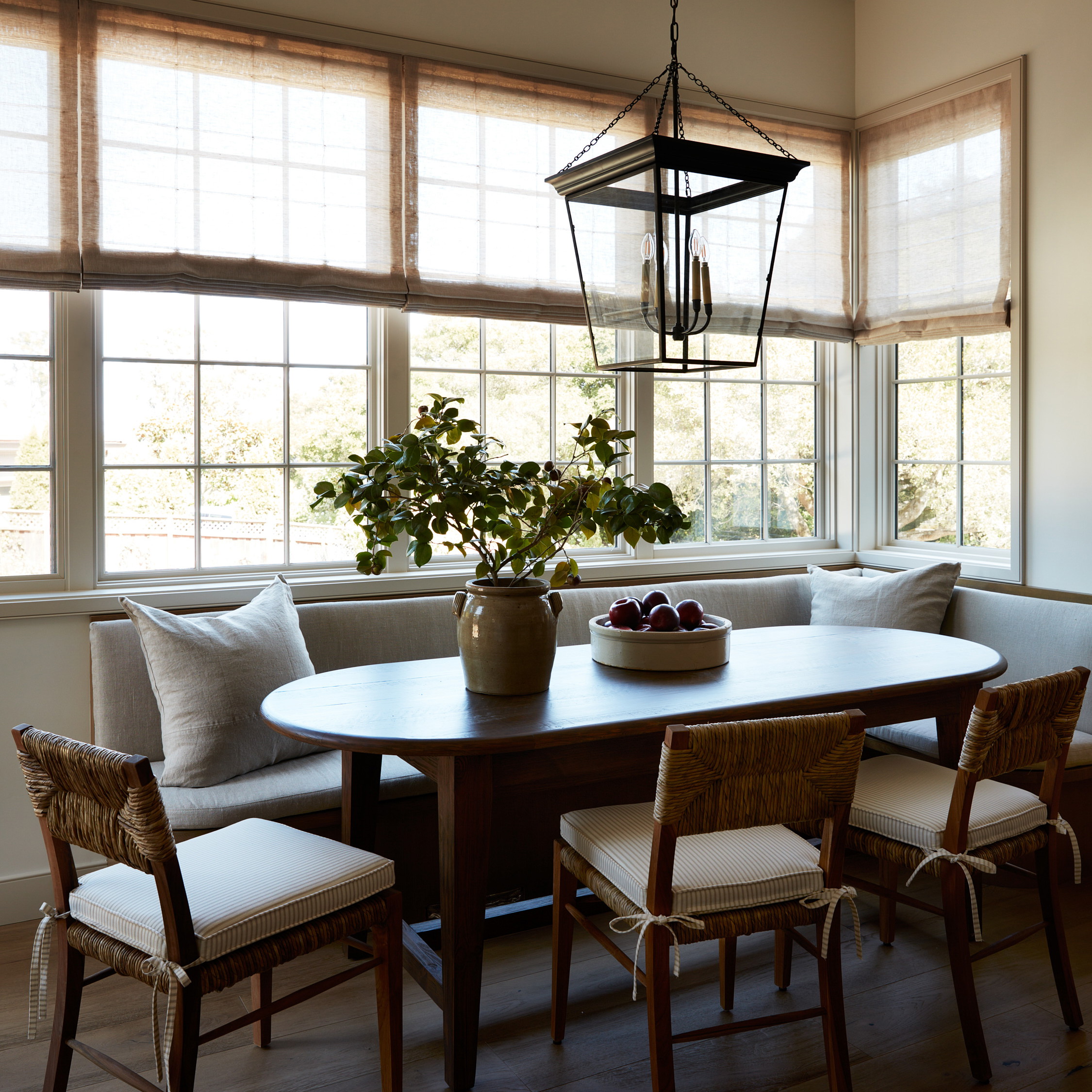 a dining room with a table and chairs