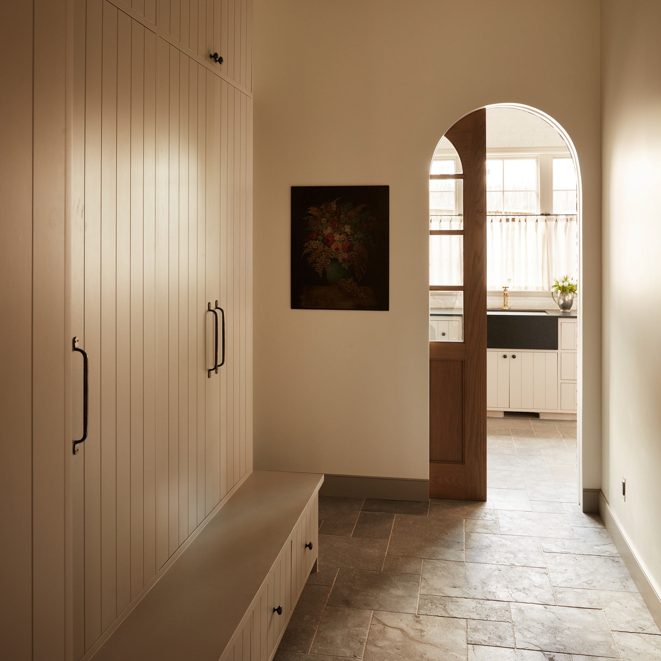 a hallway leading to a kitchen and a hallway leading to a living room