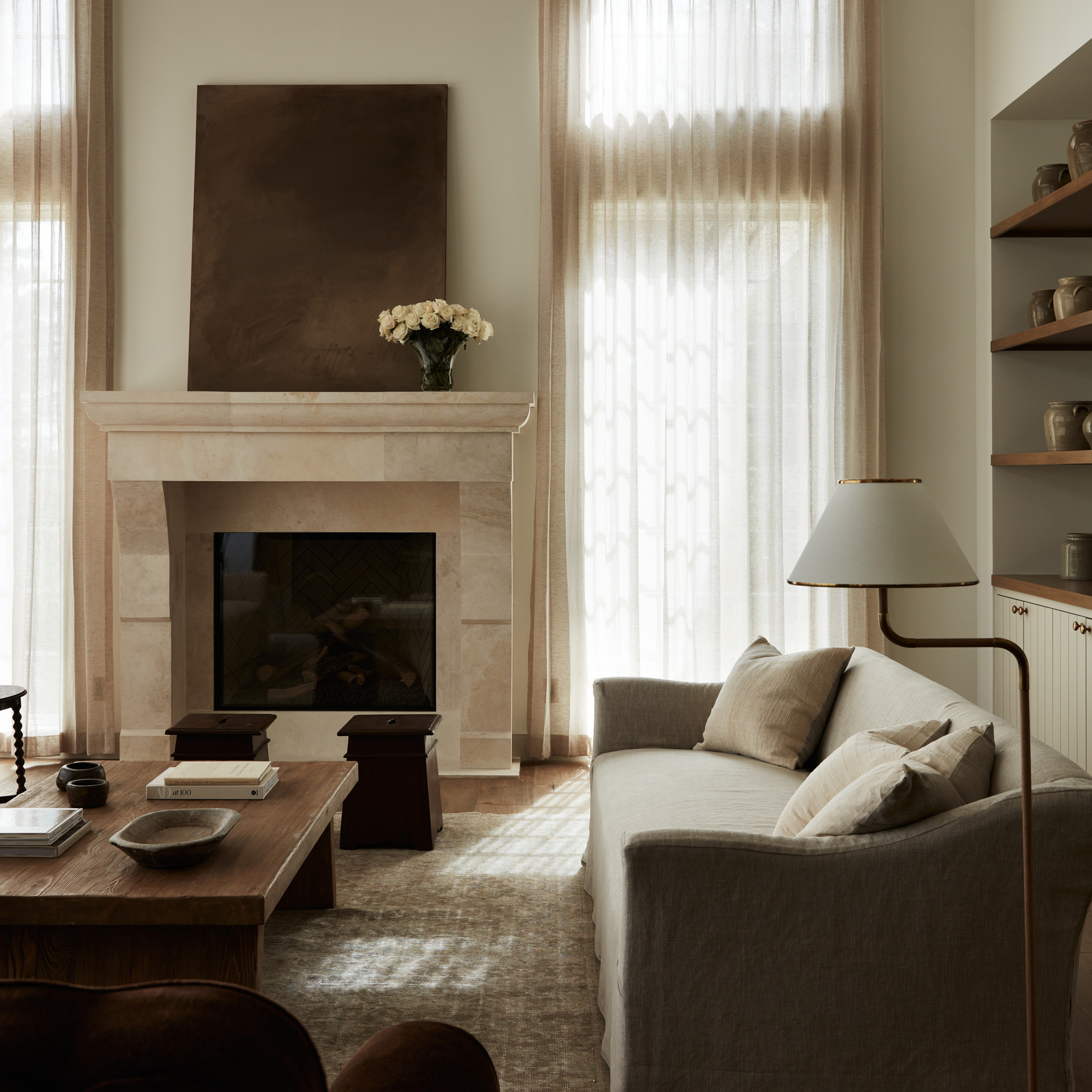 a living room filled with furniture and a fire place