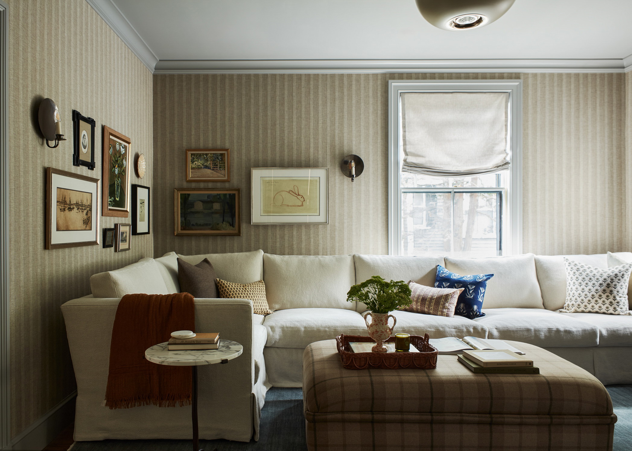 a living room filled with furniture and a window