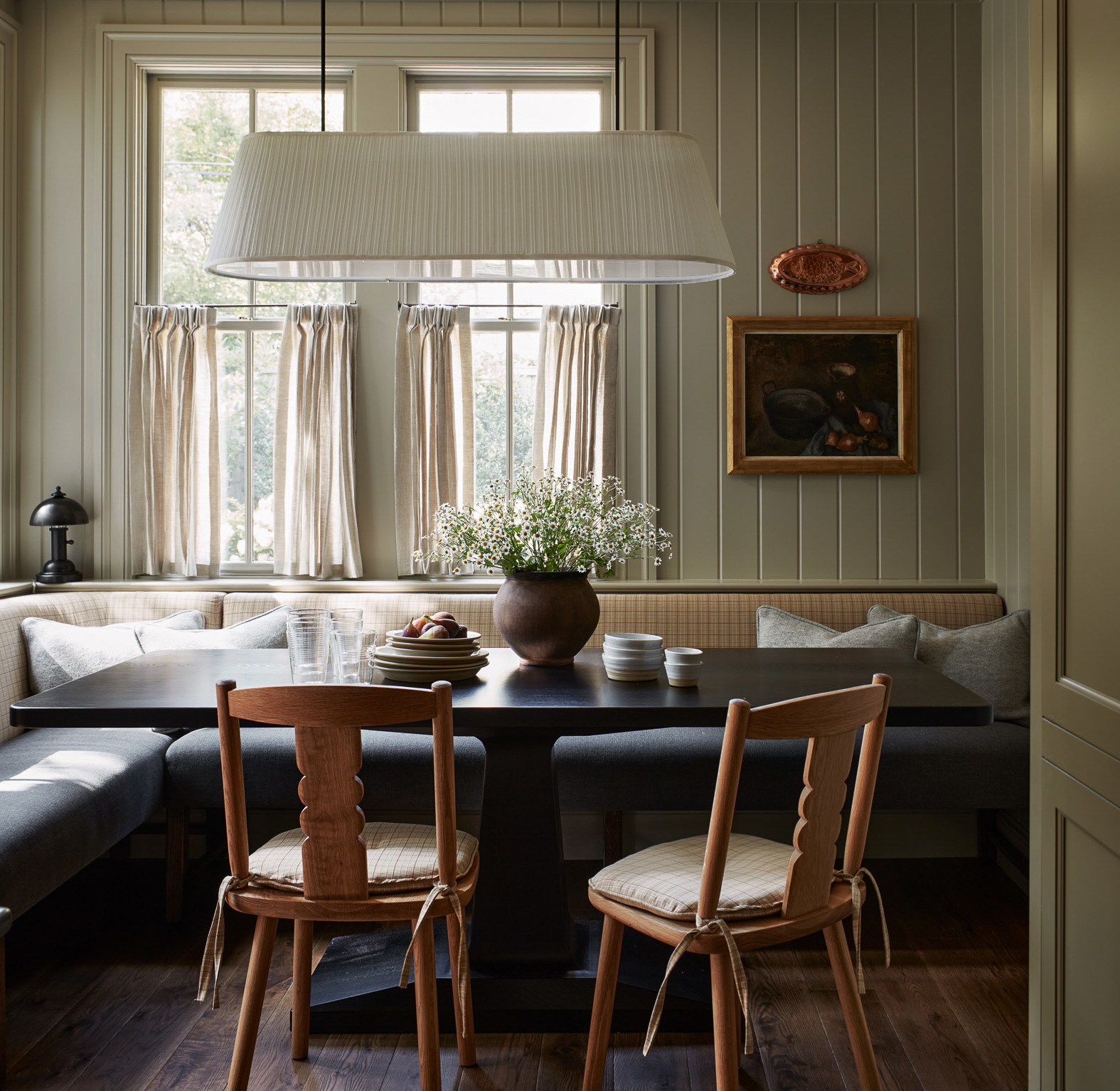 a living room with a couch a table and chairs