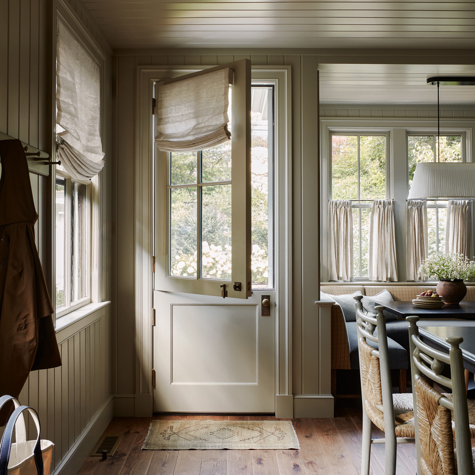 a dining room with a table and chairs