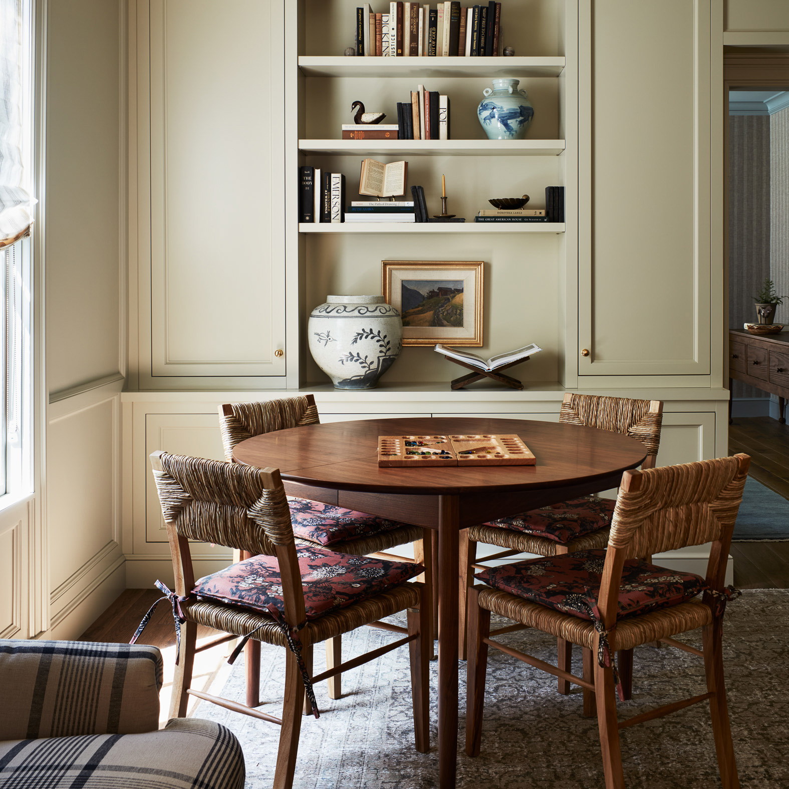 a dining room with a table and chairs