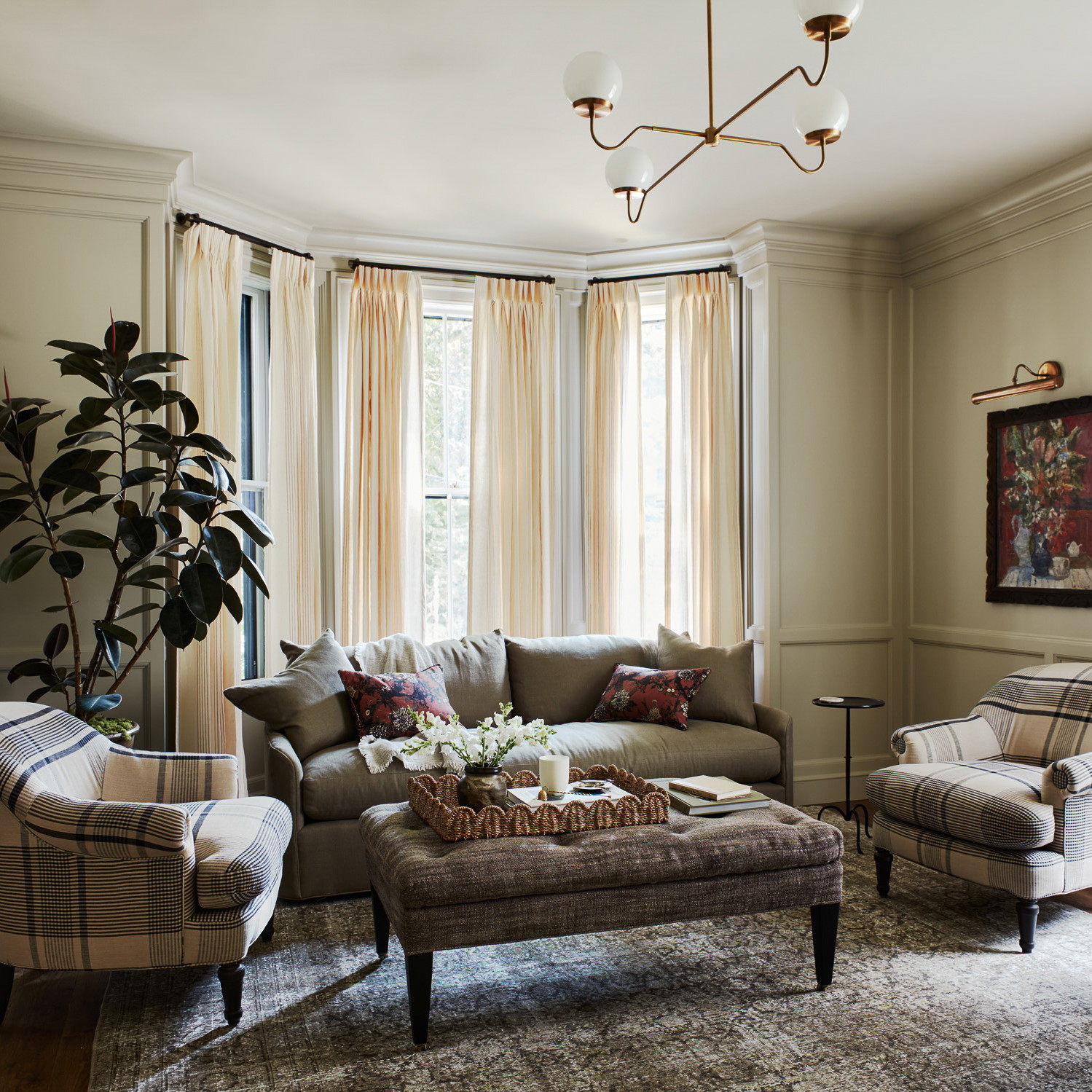 a living room filled with furniture and a large window