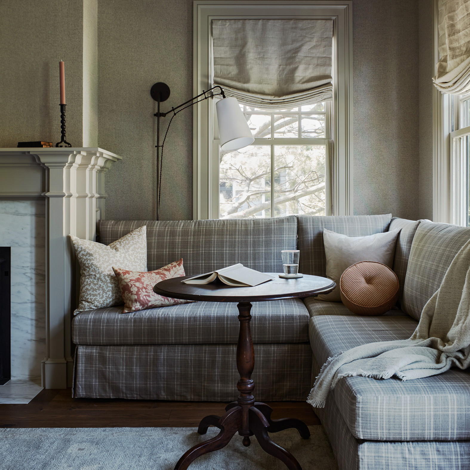 a living room filled with furniture and a fire place