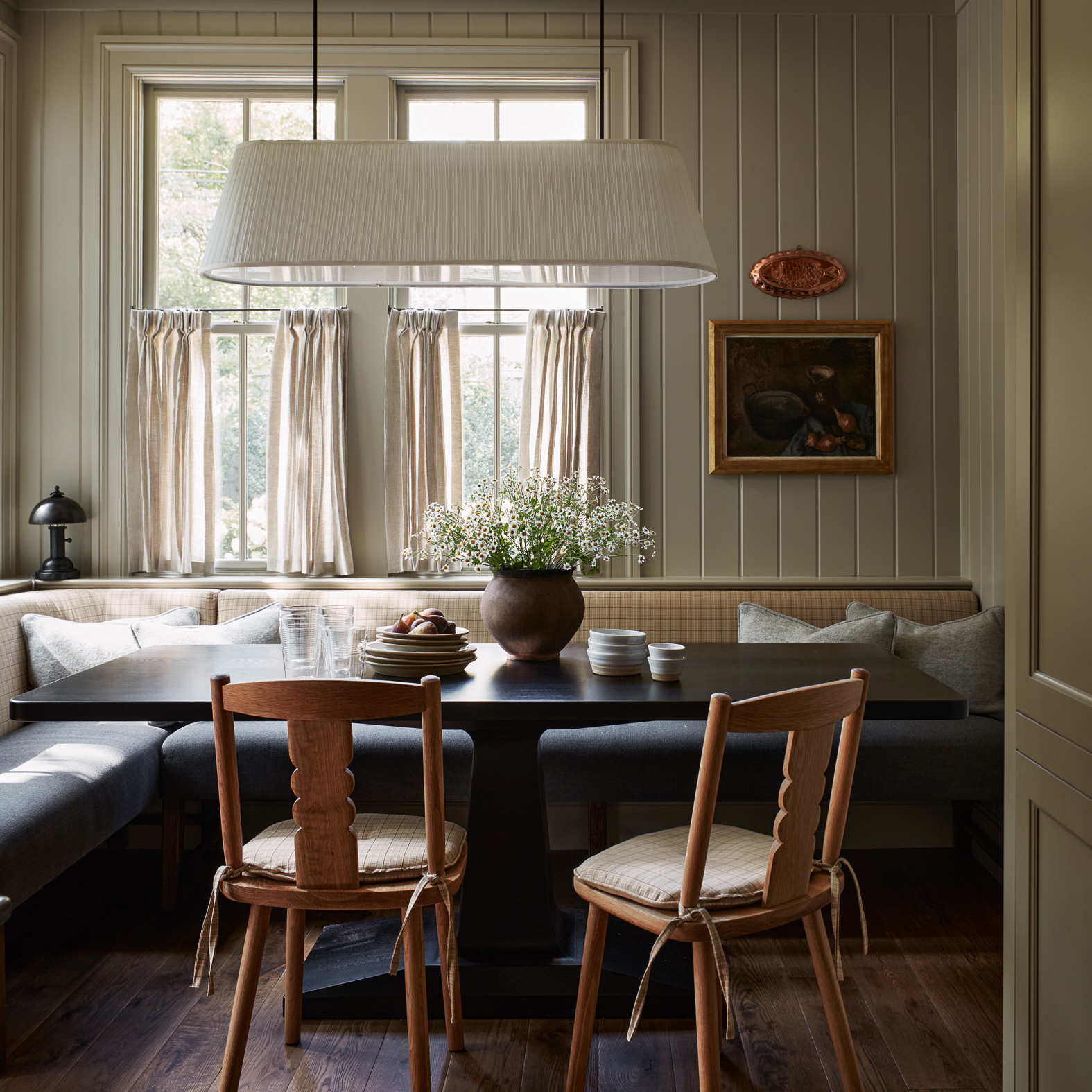 a living room with a couch a table and chairs