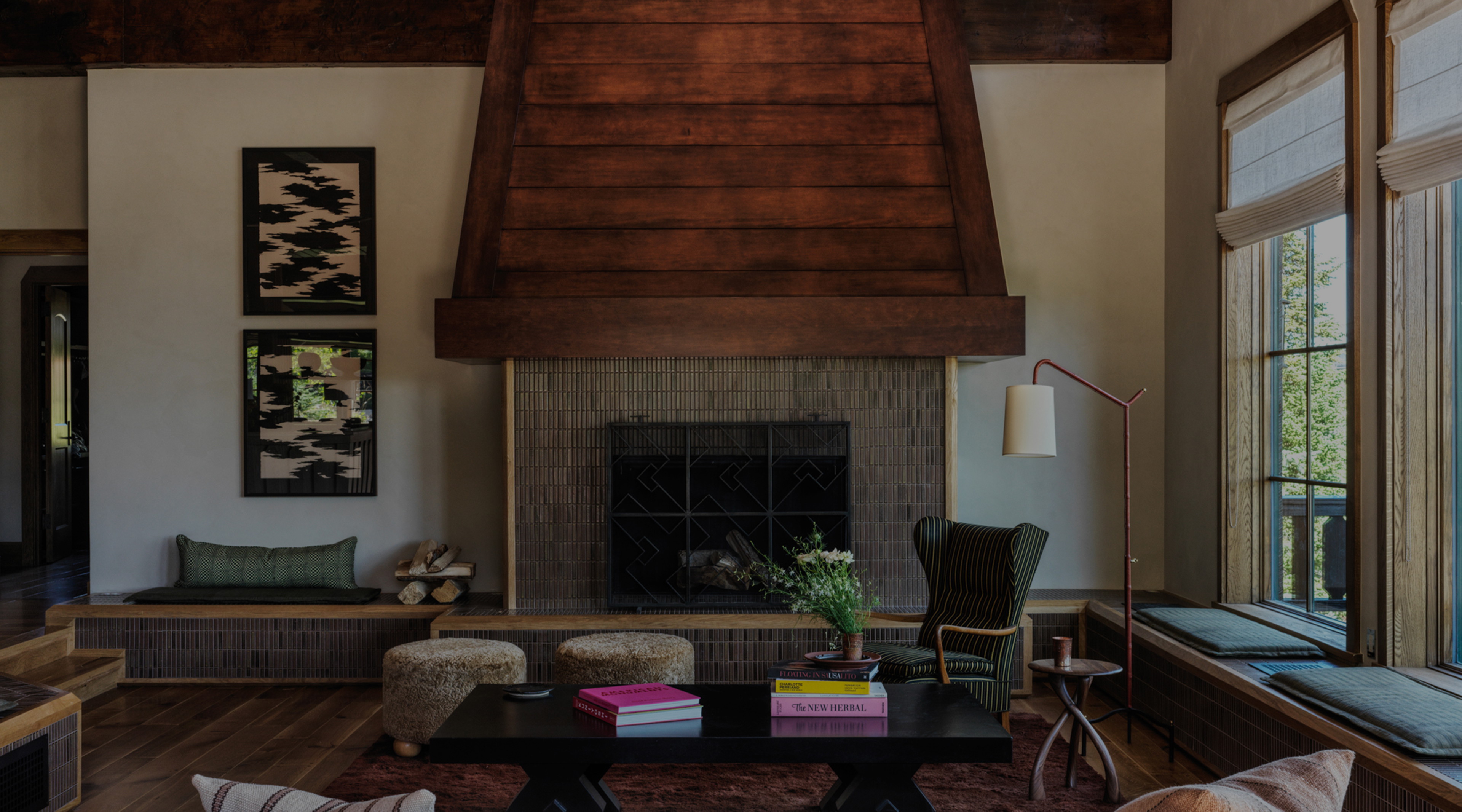 a living room filled with furniture and a fire place