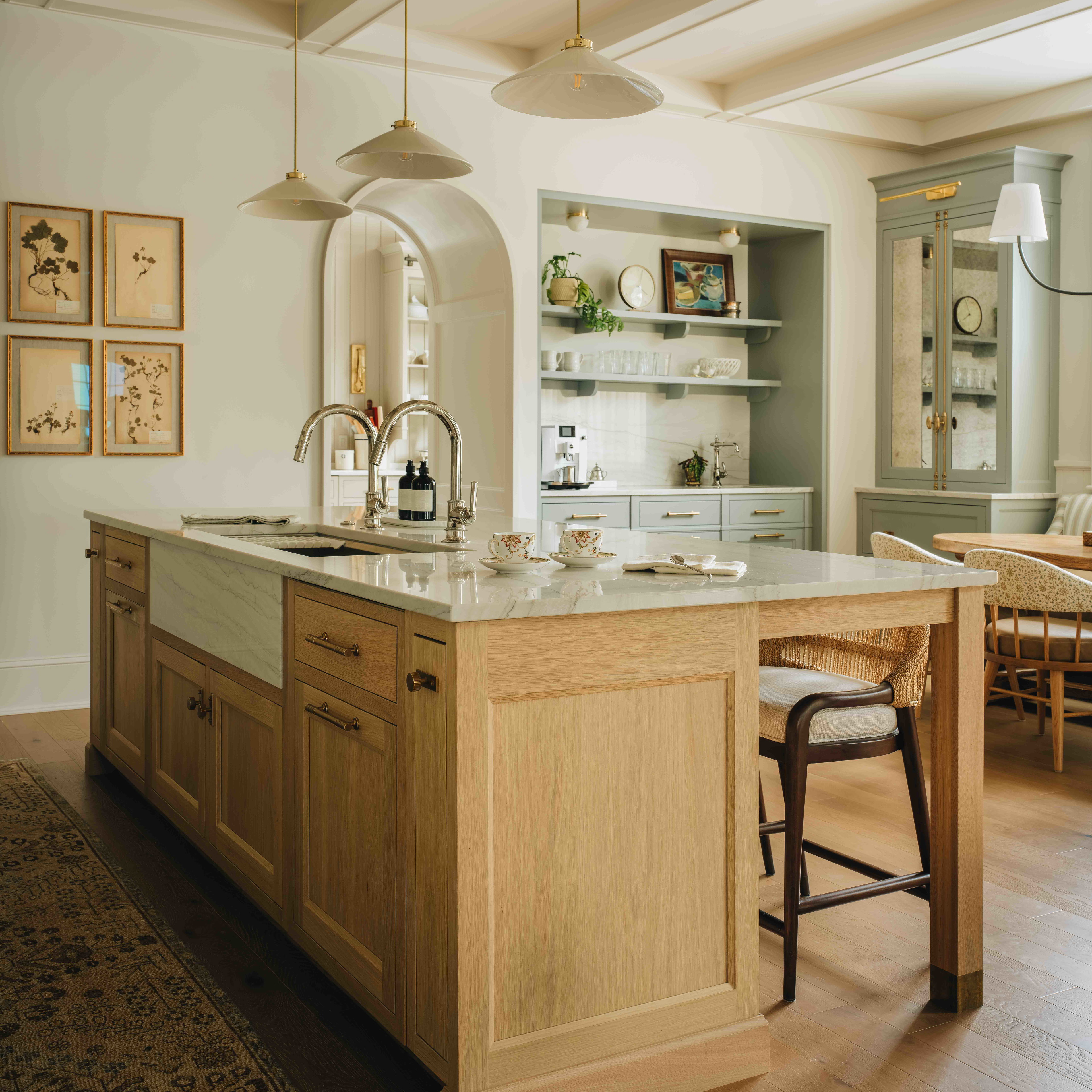 a kitchen with a center island and a dining room table