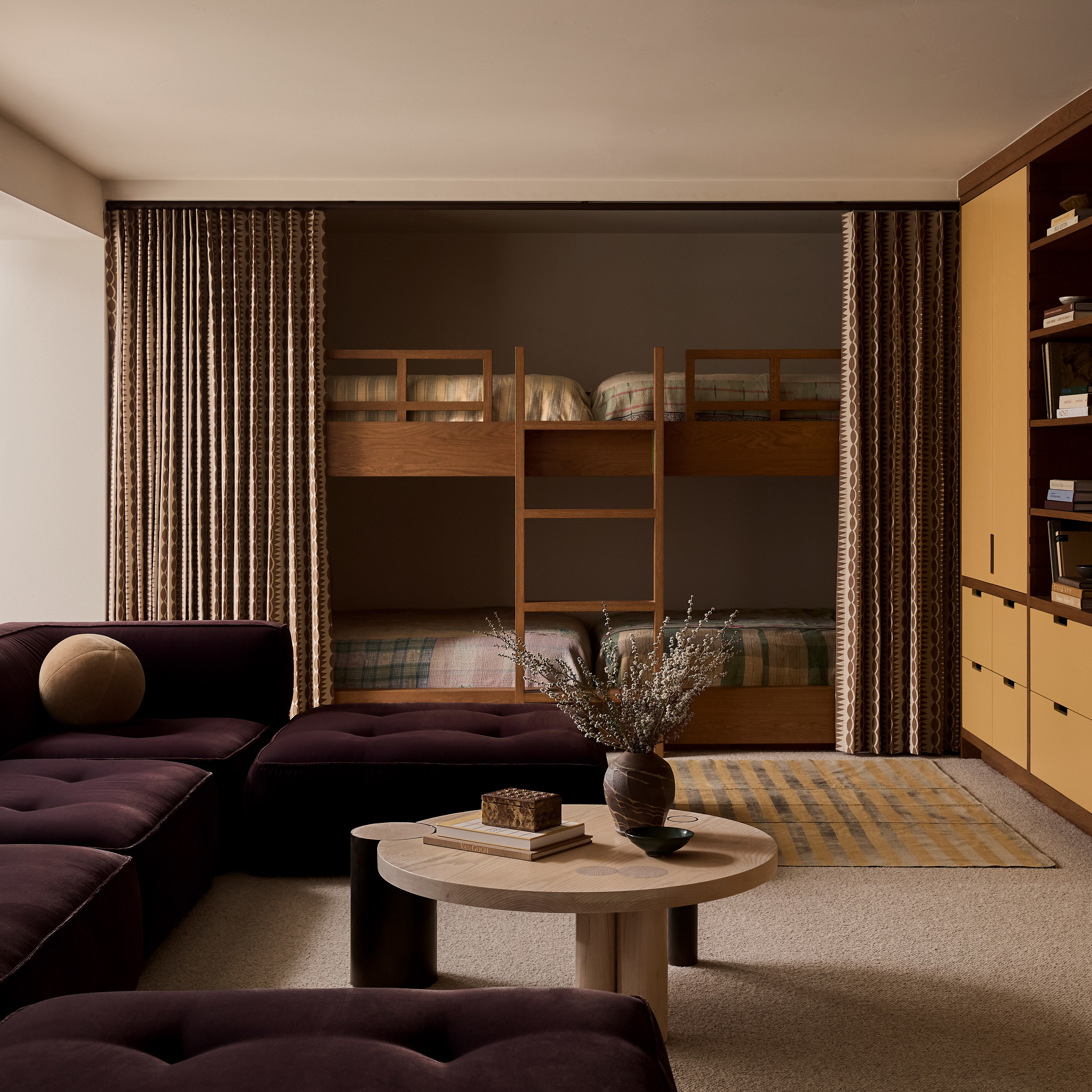 a living room filled with furniture and a flat screen tv