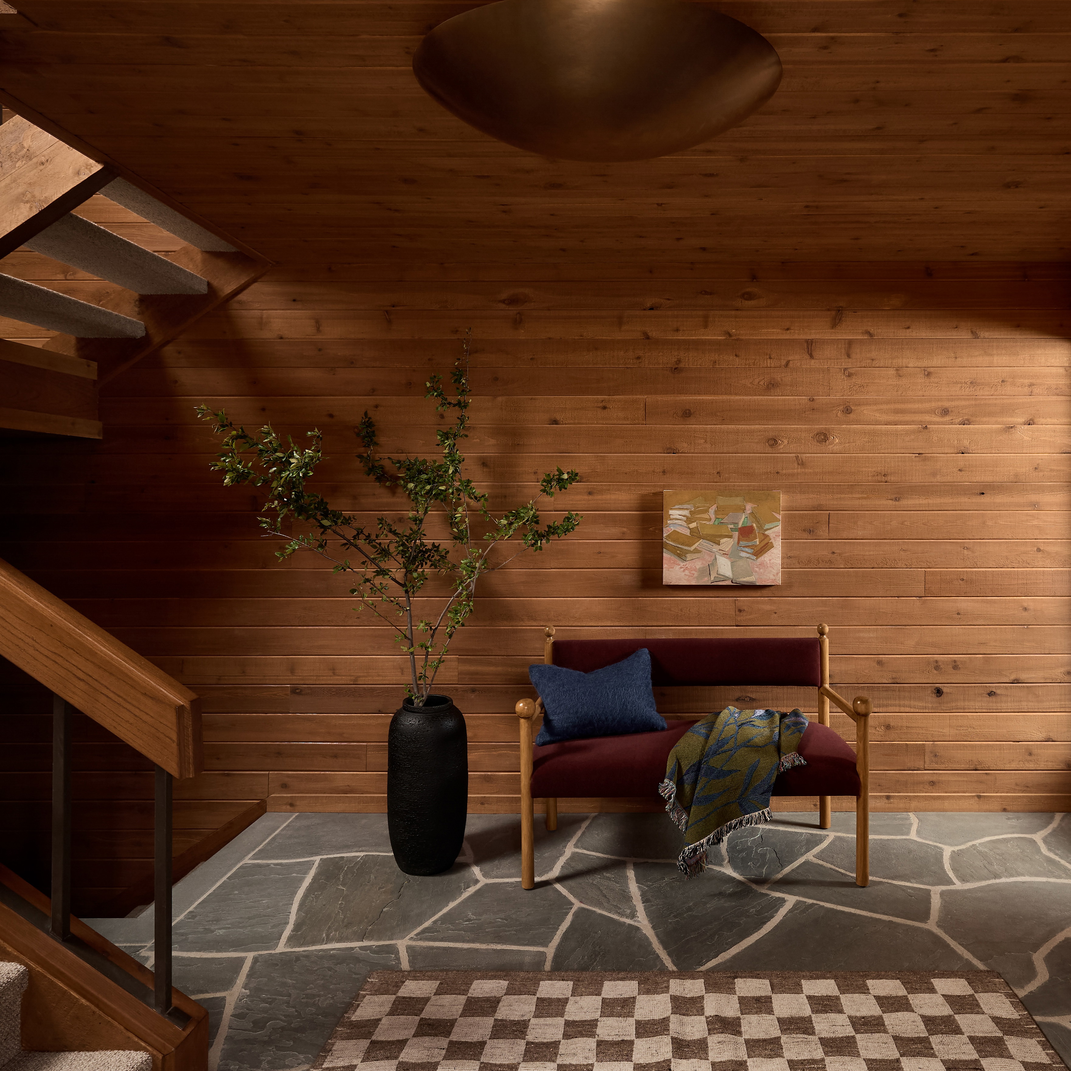 a living room with a checkered floor and wooden walls