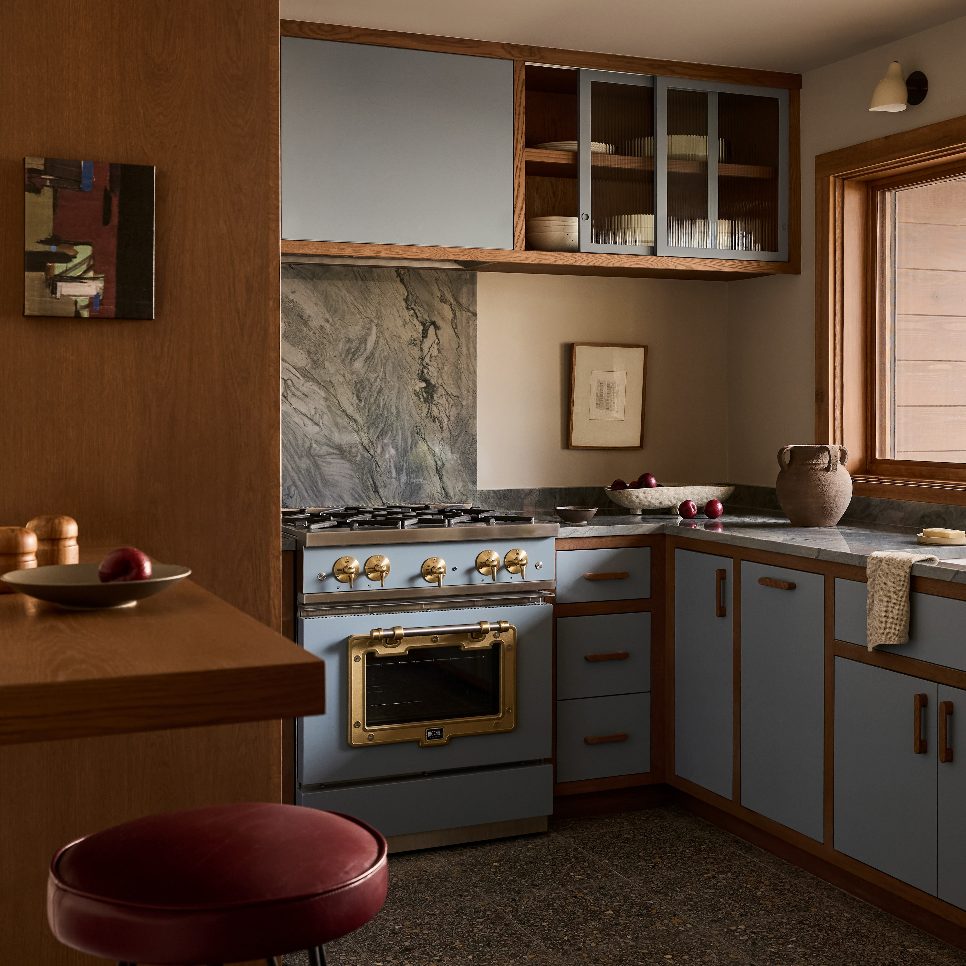 a kitchen with a stove top oven sitting next to a counter