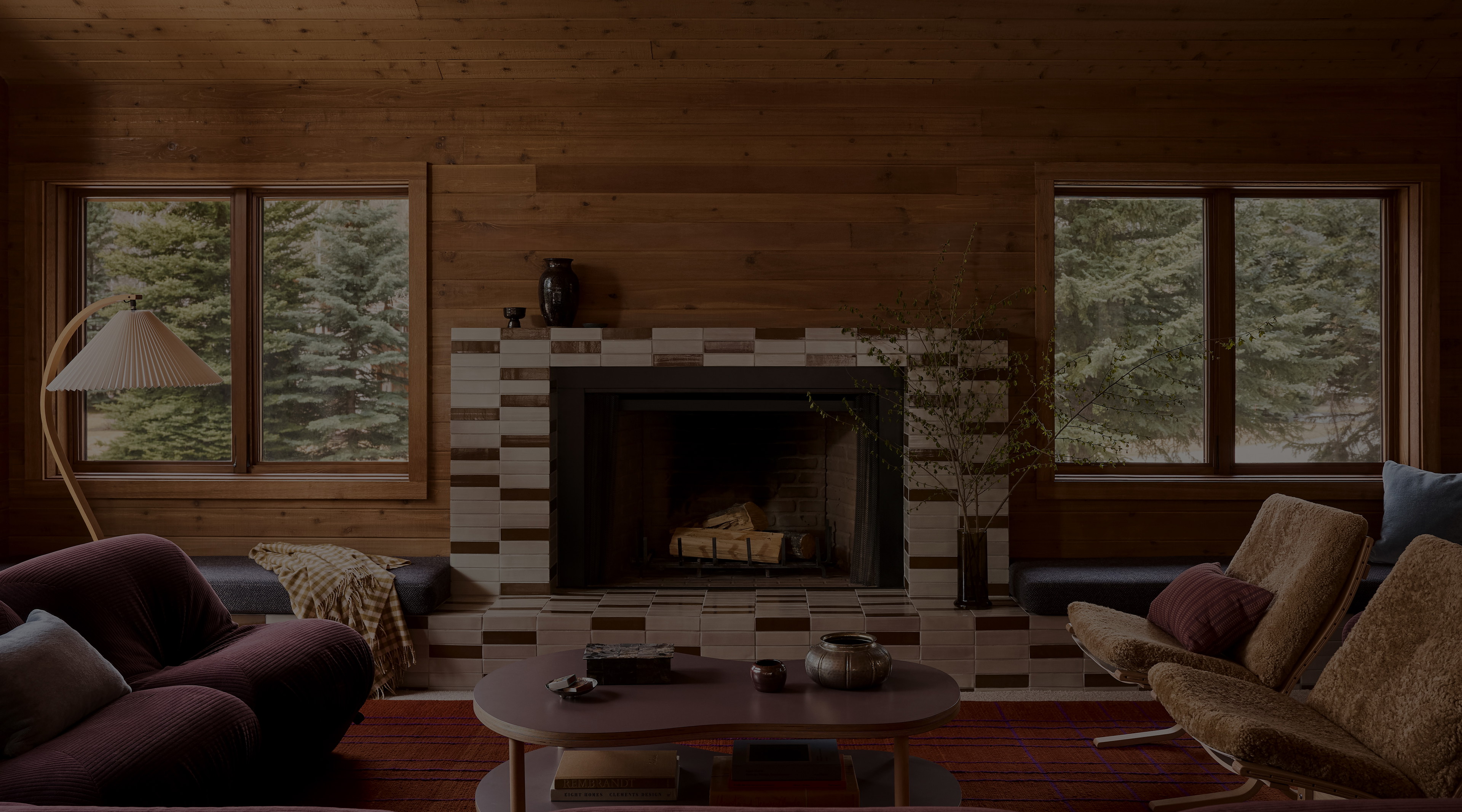 a living room filled with furniture and a fire place